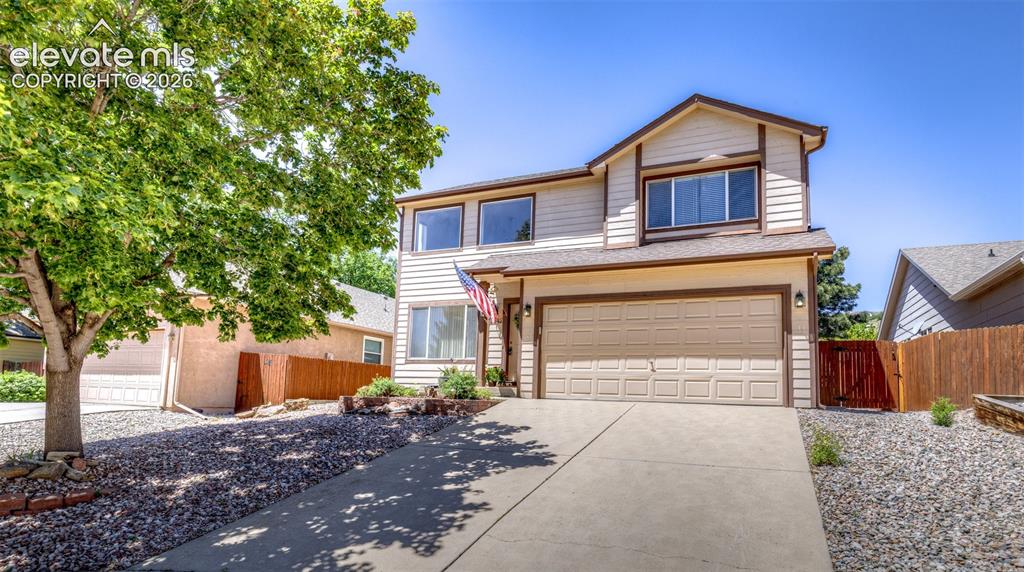 Jazzy open, contemporary & flooded with light & sunshine~ 1,400 sq ft, 2 bedroom + loft, 2 1/2 bath two story home tucked  away on a small cul de sac on the West side ~ Soaring ceilings, rounded corners, beautiful professionally landscaped xeriscaped yard ~ Overlooks from upper level ~ A/C & 2 ceiling fans. Gas log fireplace with blower ~new glass being installed on almost all windows.~ Professionally cleaned & shows great even though most finishes are still original ~ The neighborhood is located right by Ute Valley Park, Hiking & biking trails are right there & it is an easy drive to Garden of the Gods, Mountain Shadows Park, Wicks Park, Wilson Ranch Park which has a pool, waterslide, playground & picnic area, Flying W Ranch, White House Ranch & 2 elementary schools.