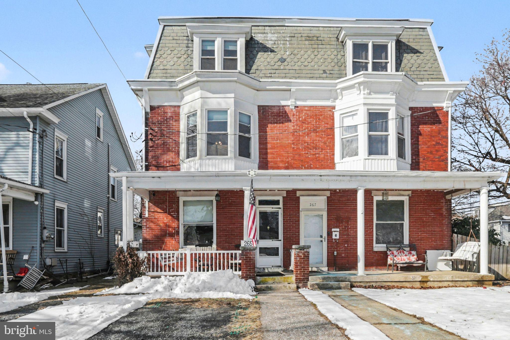 A timeless East Pennsboro classic with modern upgrades, 265 Wyoming Ave blends old‑world traditional charm with thoughtful improvements and flexible use options—zoned Commercial Limited, yet perfectly suited as a spacious residence or continued investment property.This 5‑bedroom, 4.5‑bath home is currently operated as a mid‑term rental with tenants in place. Inside, the large living room features French doors and a ventless gas fireplace, while the formal dining room showcases built‑in bookcases. The kitchen’s exposed brick and faux tin ceiling complement the home’s classic character, and the main‑floor laundry and added half bath enhance everyday convenience.All second‑floor bedrooms include their own bathrooms, with two true en suites, and the third floor offers two additional bedrooms that share a full bath. Every bedroom is equipped with a ceiling fan, and the second floor benefits from ductless mini‑split units for efficient heating and cooling. Notable updates include replacement windows, an upgraded 200‑amp electrical service, an efficient gas boiler, and a whole‑house gas‑powered backup generator. The roof was replaced in 2010, providing added peace of mind. Outside, the fenced‑in backyard includes a storage shed for additional utility. The list price reflects the real estate only. Furnishings are negotiable, offering a turnkey option for investors or those who love the current aesthetic.