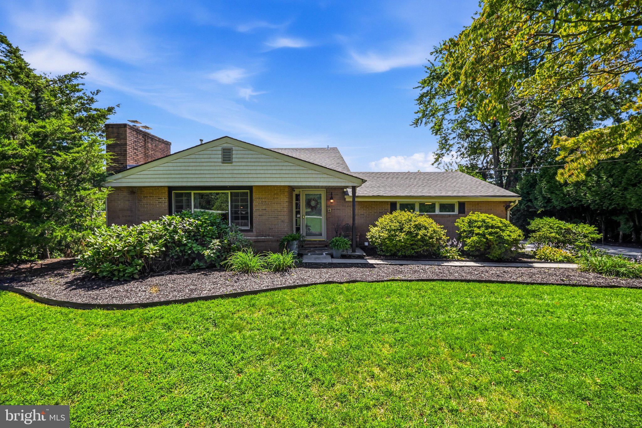 This house has a little Cape Cod, a little contemporary, a little mid-century flair - and a whole lot more space than you'd ever guess from the curb. With over 2,500 square feet and a wonderfully unexpected layout, this is one of those homes that just keeps going... in the best possible way.Step inside through the flagstone foyer, complete with a double coat closet, and into the living room featuring rubbed oak parquet floors, indirect lighting, and a pellet stove to keep things cozy. From here, step down into a sweet little sitting area that feels made for a reading nook, home office, or quiet spot to hide with your coffee.Then things get BIG. The gigantic great room is truly the heart of the house, with a fun vibe and enough room to host just about everybody you know. The kitchen features Ehst cabinetry painted a cheerful vintage green, recessed lighting, and access to the side yard. A huge dining area opens to the large rear deck, while the double-sided family room wraps around a brick fireplace with a pellet stove insert. Seriously - you could invite 100 people over and still have room to wander around looking for the snacks.The flexible main floor layout continues with a spacious primary bedroom featuring two double closets and its own private entrance. The former garage has been cleverly converted into an additional bedroom while still preserving storage space for the mower, tools, and all the stuff nobody wants in the house. A full bath with walk-in shower completes the main level.Upstairs, you'll find three more bedrooms, parquet floors, and a full hall bath, giving this home plenty of options for bedrooms, offices, hobbies, guests - or some combination of all of the above.Outside, the fenced yard offers lovely privacy and plenty of room to enjoy the outdoors, while the large rear deck is ready for grilling, lounging, and summer get-togethers. There's even a neighborhood walking trail around the nearby lake when you feel like venturing beyond your own backyard.And one very important update: a brand new roof!Quirky in all the right ways, surprisingly spacious, and packed with personality, this is definitely not your cookie-cutter house. If you need room to spread out, gather a crowd, work from home, or simply have a place for everything - this one has space to spare.