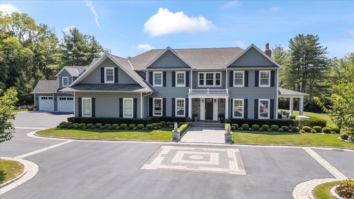 Welcome to one of North Syosset’s most distinguished new estates. Privately set on 5 gated acres, this striking property combines architectural elegance, modern comfort, and a rare sense of privacy. The main residence offers over 8,400 square feet of thoughtfully designed living space with soaring ceilings, expansive windows, and seamless indoor-outdoor flow. Ten bedrooms and twelve bathrooms, including a luxurious primary suite, provide exceptional space for both everyday living and large-scale entertaining. A separate 2,000 square foot guest house offers flexibility for visitors, extended family, or private work-from-home quarters.
Resort-style amenities include 2 state of the art outdoor kitchen areas, a heated gunite pool with spa, a private tennis court, a dog run, a playground and a serene pond, all surrounded by lush, manicured grounds. The property is located on a quiet private road within the Syosset Central School District and zoned for Berry Hill Elementary, offering both convenience and exclusivity. This is a rare opportunity to own a newly constructed compound that defines high-end living on Long Island’s North Shore.