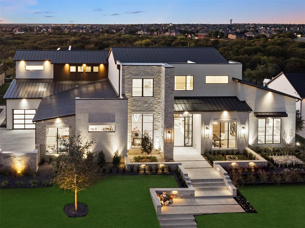 SPECTACULAR VIEWS greet you as you enter this warm, modern masterpiece. Situated on a private, elevated lot in the prestigious Hills of Kingswood — a premier gated community in Frisco with 24-hour security — this 9,906-square-foot home offers refined living with 6 bedrooms, 9 bathrooms, and 3 laundry rooms. A gated motor court offers additional privacy. Boasting panoramic views, this home blends elegance and innovation. 

The primary suite is a true retreat, featuring a spa-inspired bath with heated floors, a lavish soaking tub and expansive his and hers closet. Wellness is at your doorstep with an on-site workout center and rejuvenating steam shower.

Designed for seamless entertaining, the residence boasts a dramatic 21-foot motorized pocketing slider opening to a spectacular 60-foot pool. The outdoor living experience continues with a fully equipped kitchen, fireplace, and multiple sitting areas. The backyard features premium artificial turf, tiered levels, and a private putting green.

Upstairs, a balcony captures breathtaking views, providing the perfect backdrop for morning coffee or evening relaxation.

Every detail of this one-of-a-kind home has been thoughtfully crafted for luxury living. This home is move in ready with construction scheduled for completion in October 2025.