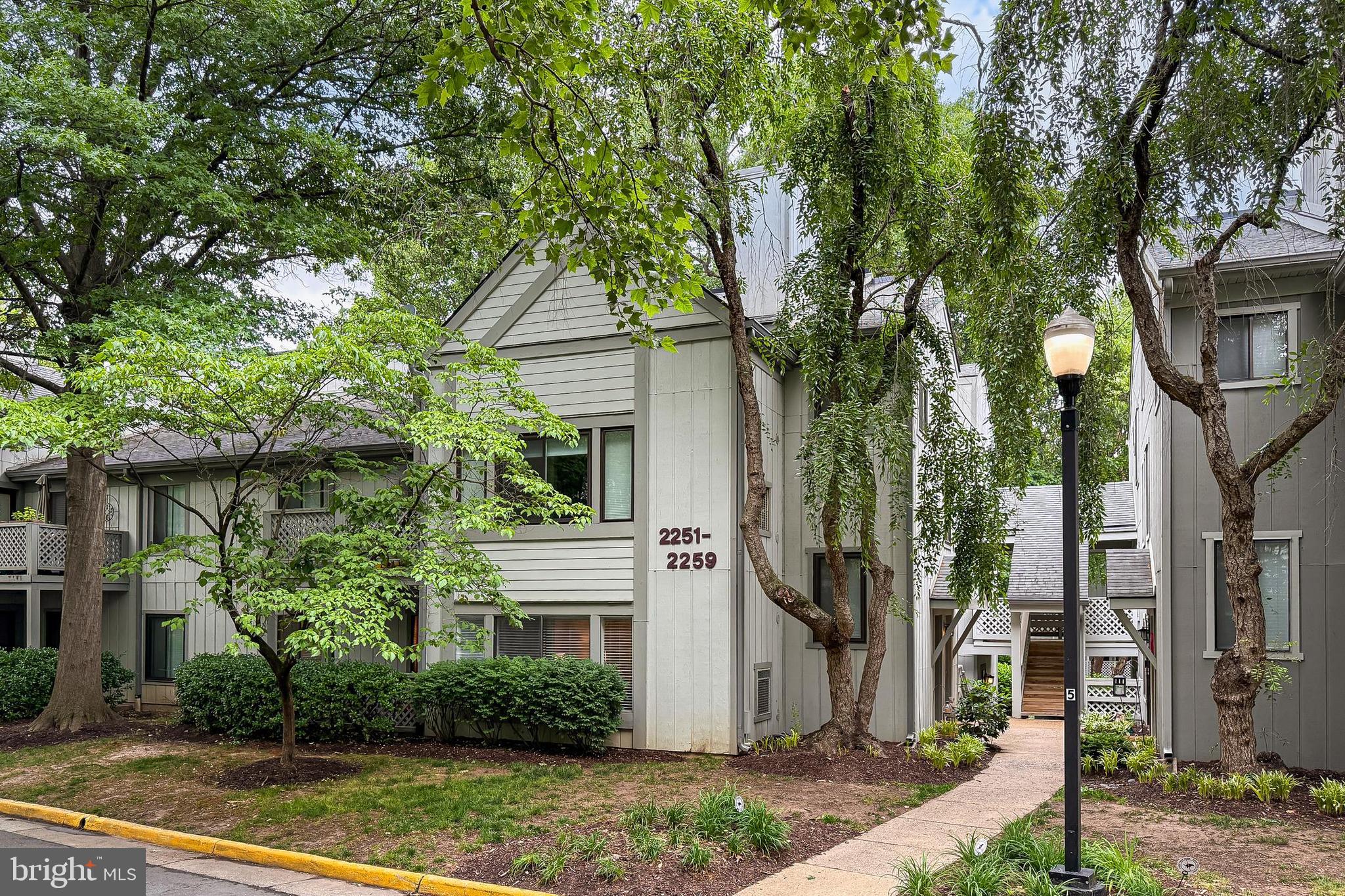 Beautifully updated 2BR/1BA ground-level condo in desirable Hunters Crossing. Spacious open floor plan featuring a large living room, separate dining area, and sun-filled bonus room perfect for a home office, den, or sitting area. Updated kitchen with granite countertops, stainless steel appliances, gas cooking, and ample cabinet space. Generous primary bedroom with walk-in closet and access to the full bath.  Private patio offering a peaceful outdoor retreat.  Recent updates and well-maintained interiors make this home truly move-in ready. Convenient in-unit laundry, assigned parking, plenty of guest parking and low-maintenance living. Enjoy Reston Association amenities, including pools, tennis courts, walking trails, parks, and recreational facilities. Prime location just minutes to Reston Town Center and Wiehle-Reston East Metro Station Silver Line Metro, shopping, dining, major commuter routes, and Dulles Airport.  A fantastic opportunity to own in one of Reston's most convenient and amenity-rich communities.