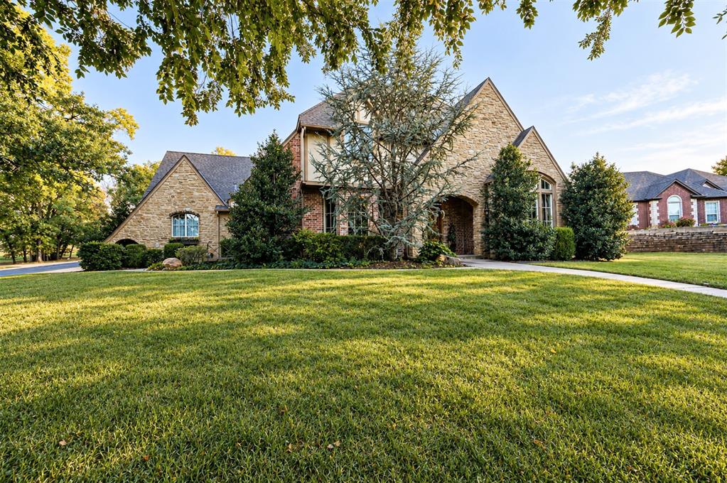 Welcome to East Edmond’s highly sought-after Bella Terra neighborhood, where timeless elegance, thoughtful updates, and inviting outdoor living come together in this meticulously cared-for home. Situated on a 0.63-acre lot, this beautiful residence offers a welcoming blend of architectural character, comfortable living spaces, and modern conveniences. From the moment you enter, you’ll appreciate the grand entryway, soaring ceilings, and stunning staircase featuring wrought-iron railings that create an impressive first impression. Beautiful, large-body tile floors enhance the entryway and guide you to the kitchen and living room. The spacious living room is anchored by a beautiful stone fireplace, creating a warm and inviting gathering space for relaxing evenings or entertaining family and friends. The generously sized kitchen features custom cabinetry, new appliances, abundant workspace, and a convenient walk-in pantry, offering both style and functionality for everyday living and special occasions. A dedicated study provides the perfect setting for working from home, managing household responsibilities, or creating a quiet retreat with a beautiful cathedral ceiling with exposed beams and oversized windows. The downstairs half bath adds convenience for guests, while 3 well-appointed bedrooms are located upstairs along with 2 full bathrooms that provide flexibility and comfort for family and visitors alike. Recent improvements include fresh interior paint and new carpet, giving the home a refreshed feel and making it move-in ready. Step outside to enjoy the wooded backyard, where mature trees provide a beautiful natural backdrop and a sense of privacy. The large covered patio creates an ideal setting for outdoor dining, morning coffee, or relaxing evenings surrounded by nature. Bella Terra residents enjoy an exceptional collection of neighborhood amenities, including a community swimming pool, clubhouse, park, basketball court, and open grassy sports field.
