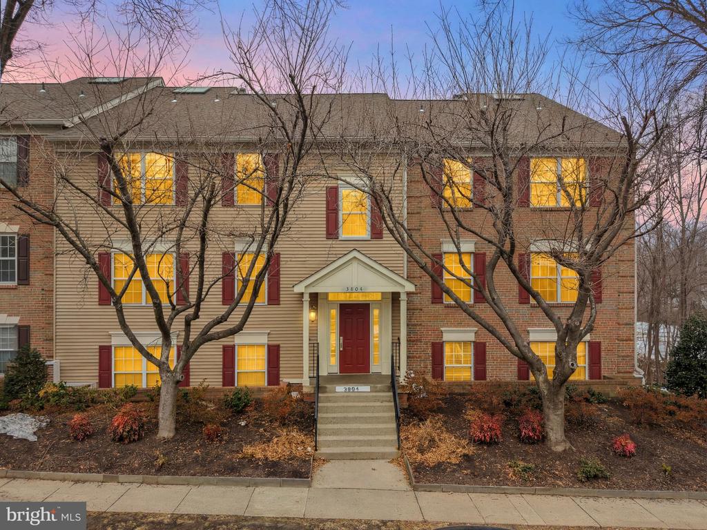 Welcome to this charming two-level condo featuring dramatic two-story ceilings and a stunning wood-burning, floor-to-ceiling stone fireplace that anchors the inviting living room.  A sunny bump-out creates the perfect space for a reading nook, lounge area, or morning coffee retreat. Multiple skylights in the loft and living room fill the home with natural light, creating a bright, airy atmosphere with a modern penthouse feel.  The adjacent dining room flows seamlessly into the lovely upgraded kitchen, complete with stainless steel appliances and elegant granite countertops—ideal for both everyday living and entertaining. The light-filled bedrooms offer comfort and privacy, including a spacious primary suite with an ensuite bath and walk-in closet. The remodeled bathrooms feature new vanities and custom tilework, including beautifully finished floors and shower surrounds.  Upstairs, the versatile loft provides the perfect work-from-home office, guest space, or secondary living area, enhanced by open views below.  A closet converted into a workshop area is a perfect utility space for storing holiday items, cleaning supplies or tools.  Lovingly maintained, this warm and welcoming home combines architectural character, thoughtful upgrades, and functional living spaces—ready for its next owner to enjoy.  Amenities include a pool, nearby golf courses, a playground, and a basketball court.   Prime location with easy access to Fair Oaks Mall, 66 and Fairfax Co Pkwy.