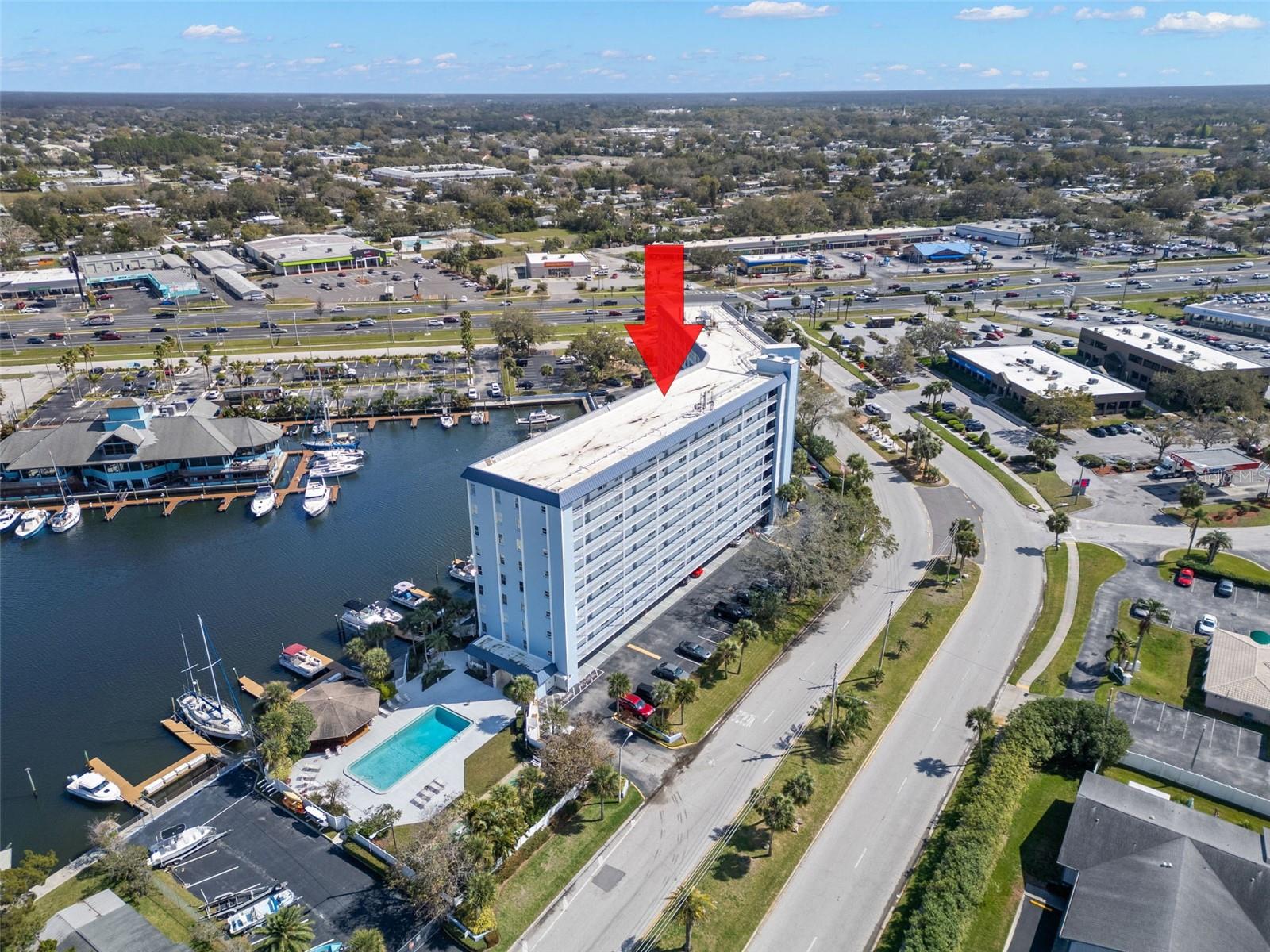 Coastal Charm Awaits! Welcome home to this adorable, fully updated 1-bedroom, 1-bath waterfront condo, move-in ready and perfectly positioned near US Highway 19 for easy access to shopping, dining, and recreation. Enjoy beautiful water views from the open-concept living, dining, and kitchen areas—ideal for relaxed coastal living. The stunning, updated kitchen features subway tile backsplash, soft-close cabinetry with stylish two-tone design (gray lower cabinets, white uppers), and sleek stainless steel appliances. Luxury vinyl wood-look flooring flows throughout the unit, complemented by shiplap accent walls, thoughtfully coordinated lighting, and ceiling fans that enhance the home’s coastal, nautical charm. The spacious primary bedroom offers a walk-in closet with custom built-in shelving, plus an additional wall closet for extra storage. The beautifully updated bathroom is a true retreat, featuring a step-in shower with dual showerheads and a built-in niche. A convenient linen closet with shelving sits just outside the bathroom. Additional upgrades include newly installed closet doors, an updated front entry door, and meticulous attention to detail throughout. This unit is conveniently located near the building elevators for easy access and there are laundry rooms at both ends of the floor. The resort-style community offers an impressive array of amenities, including a waterfront pool and gazebo—perfect for enjoying breathtaking Florida sunsets—shuffleboard courts, community docks (available to rent or purchase when available), laundry rooms on every floor, bike storage, workshop space, and a private storage shed. Residents also enjoy a welcoming lobby with ample seating and convenient access to mailboxes. Optional Gulf Harbors private beach membership is available for just $200 annually. Located next to the new Aqua Harbor luxury development, with units valued at $500K+, this condo offers exceptional value and lifestyle. Furniture is not included but may be negotiated. Perfect as a primary residence, vacation getaway, or winter retreat—all that’s left to do is move in and start living the coastal dream. Schedule your showing today!