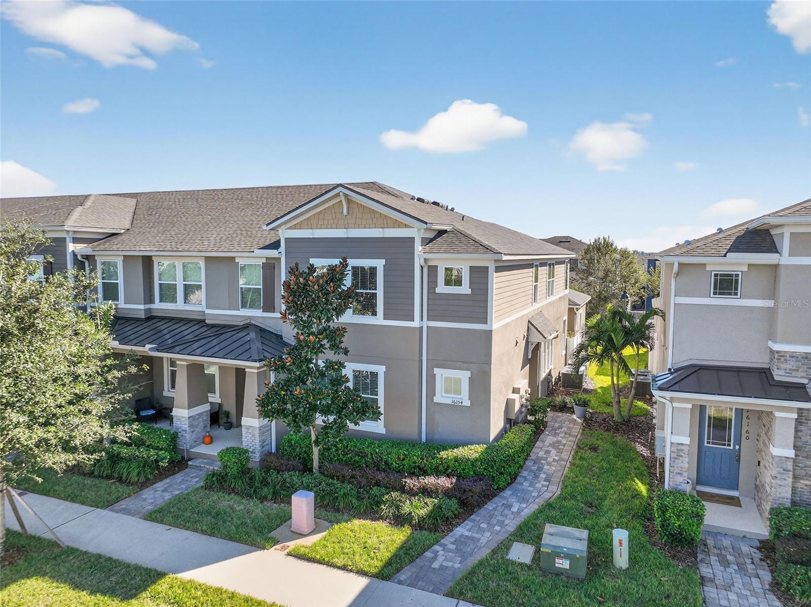 Step inside this Winter Garden stunner and feel your shoulders drop. Everything about this upgraded and move in ready, 3 bedroom, 2.5-bath Hawksmoor townhome whispers comfort, style, and ease.  Just bring your clothes.  The furnishings are included!The moment you enter, sunlight pours across the upgraded luxury vinyl plank floors, and the entire main living space feels warm and inviting. The kitchen is the kind of space that makes guests say things like “How do you ever leave this house?” Quartz counters, upgraded cabinetry with under cabinet lighting, a tiled backsplash, and sleek stainless appliances all come together in a way that feels both modern and timeless. The WiFi connected refrigerator with a built in Keurig and the new Bosch dishwasher creates the beautiful blend of style and high-end convenience.The primary suite sits privately on the first floor, which means quiet mornings, and peaceful evenings become part of your everyday rhythm. Upstairs offers two spacious bedrooms with walk-in closets, a versatile loft that can become a play area, workout room, media space, or office, and a full laundry room that keeps everyday living effortless.This home is filled with thoughtful upgrades that enhance comfort and peace of mind. A whole house surge protector, UV protective film on the family room windows, a WiFi enabled garage door opener with camera, and three exterior security cameras are already in place. Washer and dryer are included, and all furnishings are included for buyers who want a seamless move in.Step outside to your private courtyard and enjoy a quiet spot for morning coffee or evening unwinding. Exterior maintenance and landscaping are handled for you which means more living and far less doing. The HOA covers lawn care, exterior cleaning, paver upkeep, and reserves for future roof and exterior painting. Residents enjoy resort level amenities including a zero-entry pool, splash pad, fitness center, clubhouse, parks, playgrounds, and beautifully maintained sidewalks throughout the community. Hawksmoor is known for its charm, walkability, and strong sense of community. Nearby schools include Atwater Bay Elementary, Water Spring Middle, and Horizon High. Short term rentals are not allowed in this neighborhood preserving a connected residential atmosphere that many buyers value.This home is both easy on the eyes and easy to live in. For someone searching for style, simplicity, and a location that keeps them close to everything while still feeling wonderfully tucked away, 16154 Treadwell Street delivers it all.