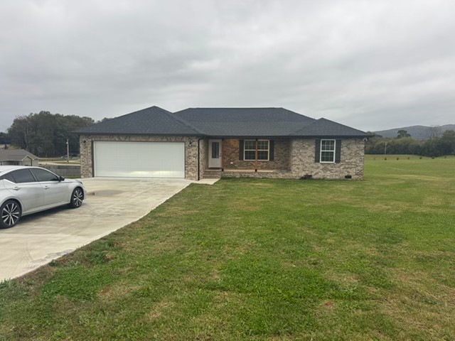 3 bedroom 2 bath all brick home in the country. Home is ready for a new renter. Open concept floor plan, split bedroom, fireplace, all appliances in the kitchen, walk-in shower in the master, attached 2 car garage, and a spacious deck on the back of the home.