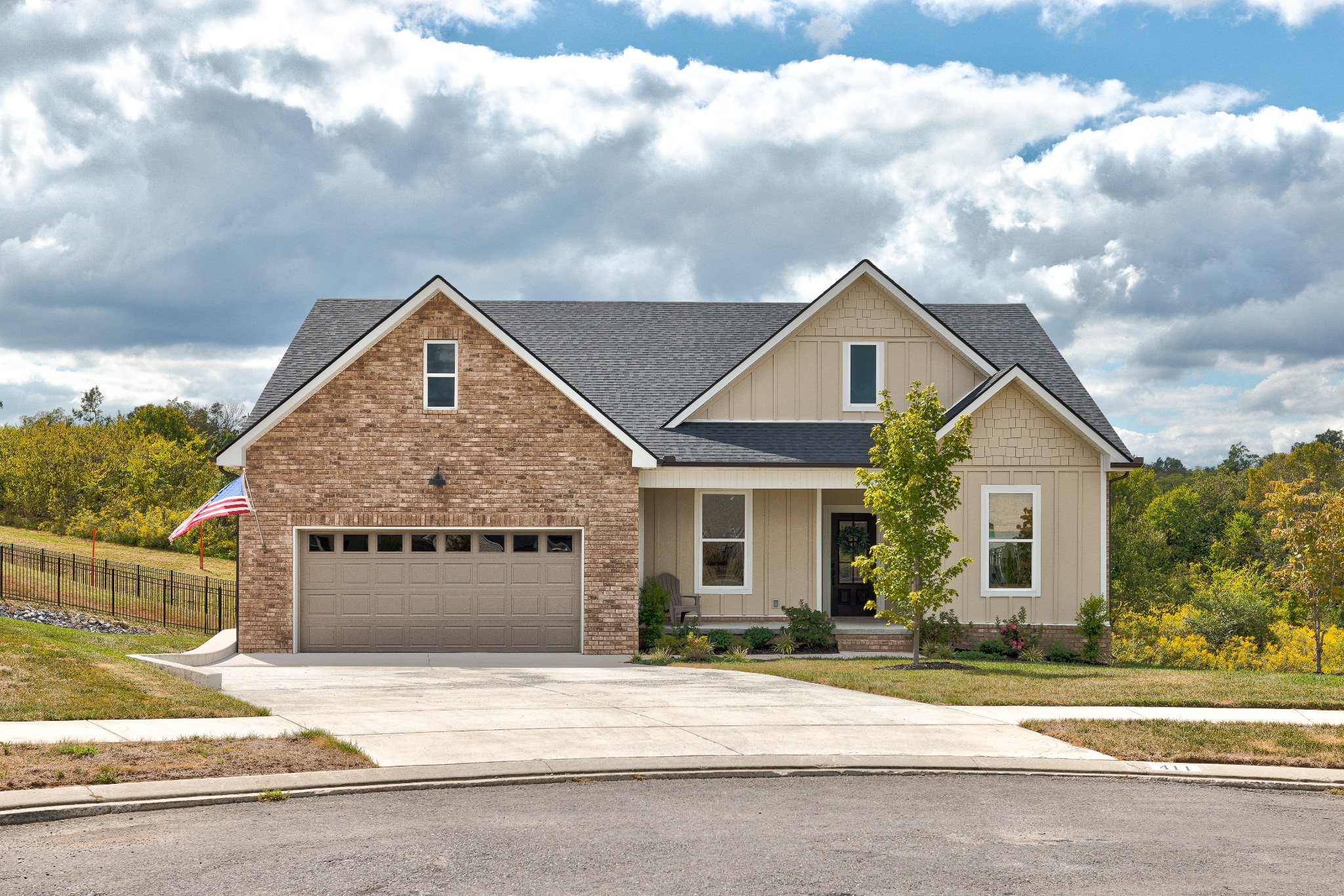 At the end of a cul-de-sac in The Ridge, this 2023 home offers main-level living, a walkout basement, and thoughtful upgrades. Built by a local semi-custom builder, the 4-bedroom, 3-bath home sits on 0.34 acres and offers 3,184 finished square feet. Nine-foot ceilings span both levels, including unfinished basement areas. A tray ceiling and custom white oak built-in entertainment center distinguish the great room. Real hardwood flooring extends across the main and finished basement living spaces. The upgraded kitchen features cabinets to the ceiling, soft-close drawers, quartz countertops, an upgraded sink and faucets, upgraded appliances, gas cooking, and a pantry. A reverse-osmosis drinking-water system and whole-house water filter add convenience. Wainscoting finishes the separate dining area. Three bedrooms and 2 full baths are on the main level, including the primary suite with a separate tub and shower. Quartz bath countertops, added vanity drawers in the primary bath, and updated light fixtures in the living areas, kitchen, primary bedroom, and bath add polish. The finished walkout basement adds a fourth bedroom, full bath, spacious 28x17 media room, and dedicated office/flex room. Crown molding accents finished rooms on both levels, including 7-inch trim in the basement bedroom and office. The home also includes a tankless water heater, covered deck, covered patio, front porch, and attached 2-car garage. Enjoy a serene backyard view across expansive green space to the hills beyond. Beyond the finished square footage, 567 square feet of unfinished yet usable basement space provides storage, room for workouts, hobbies, and projects, plus a lower-level place to gather during storms. The Ridge offers a community pool, playground, and sidewalks, with access to I-24, Nolensville's shops and restaurants, Smyrna amenities, and Tanger Nashville. Zoned for Rutherford County's Rock Springs Elementary, Rock Springs Middle, and Stewarts Creek High.