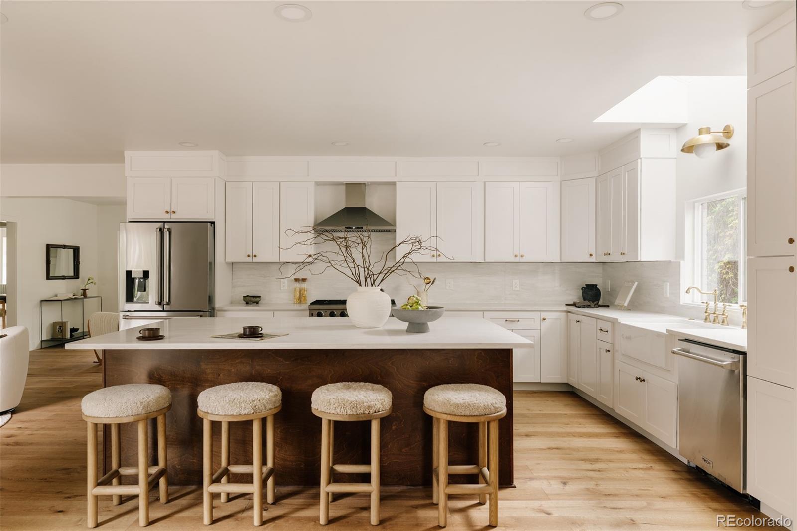 Welcome to 245 Albion Street — a masterfully reimagined Hilltop residence that blends classic character with modern updates. Transformed from the ground up, this stunning home now spans nearly 5,000 square feet across three thoughtfully designed levels, including a newly added second floor and a fully excavated basement. From the moment you step inside, the open-concept layout draws you in with clean, classic finishes and an effortless flow designed for both everyday living and entertaining.The main level is where the home truly shines — a well-appointed kitchen anchors the open living and dining areas, while a private office and a secondary primary suite offer incredible flexibility for guests, multigenerational living, or whatever your lifestyle demands. Upstairs, the newly constructed second floor is home to the primary suite, complete with a private ensuite bath and convenient in-unit laundry. Two additional bedrooms round out the upper level with generous space and a comfortable feel.The fully excavated basement adds even more to love, delivering a private guest bedroom and a dedicated home gym — everything you need without ever leaving home. Step outside and you may be surprised — the backyard is a true retreat. Mature trees create a natural canopy that buffers the surroundings and gives the space a remarkably quiet, tucked-away feel. Whether you're relaxing on the back deck or enjoying the yard, it lives far more privately than you'd expect. Set on one of Hilltop's most desirable streets, 245 Albion places you steps from Cranmer Park, with easy walkability to the shops, restaurants, and energy of Cherry Creek.This is not a renovation — it's a reinvention. Schedule your showing today.