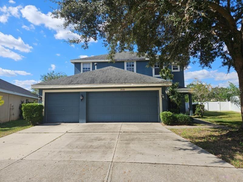 Beautiful 5 Bedroom 3 Bathroom 3 Car Garage Fenced Home Located in the Quiet in Live Oak Community. Great floorplan with porcelain glazed tile throughout the first floor. Home features a grand entry with vaulted ceilings and formal dining & living rooms with a bedroom and full bathroom downstairs. Kitchen features Silestone countertops, an island w/breakfast bar and appliances including the range, dishwasher and microwave. Primary bedroom suite is large with a walk-in closet, and a private bathroom feature separate vanities and a separate garden tub and shower. Home also features upgraded light fixtures, ceiling fans, blinds, an interior laundry room, 4 additional good size bedrooms, storage and so much more. Exterior is covered and screened providing a comfortable space to entertain family and friends. Community amenities include a gated entrance, resort style pool w/water park & splash zone, playground, volleyball courts, tennis courts, a fitness center and a clubhouse. The location is exceptional just minutes from everything including schools, shopping, restaurants, I-75 and I-275. Please call to schedule a showing today!