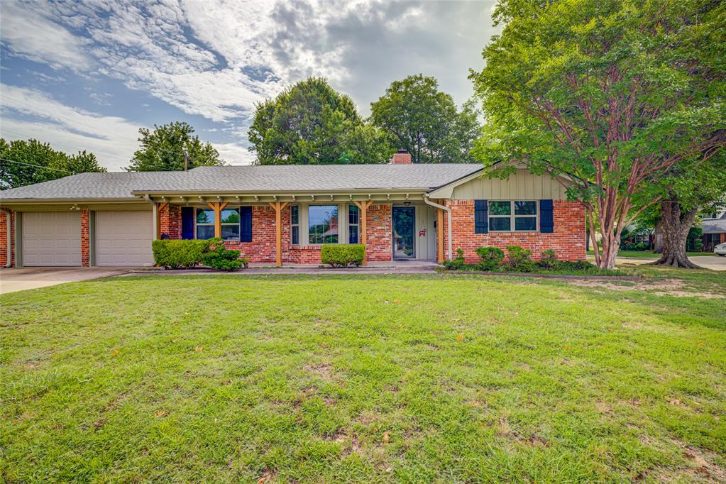 WHAT A BEAUTY!! You will love all the Special touches to this wonderful home located on a large corner lot. Natural light pours in from the bay window in front to the large picture window in back.  Circular layout of kitchen, dining and living rooms make entertaining a breeze.  Large breakfast bar welcomes guests or kids doing homework while Mom and Dad cook.  New quartz countertops are complemented by tile backsplash.  You will love the wood floors in Living and Dining, built-in buffet offers ample storage for  china, linens and serving pieces .  French doors lead into the large sunroom, great for morning coffee, game night or extra play area for kids.  Both baths have been updated and all bedrooms feature double closets.  AC recently replaced and new roof in 2021.  This well-cared for home is with walking distance from highly rated Cleveland Elementary . Easy access to OKC and University of Oklahoma.  You can bike to campus or downtown for Arts and Community events.  University North Park shopping just minutes, full of great stores and restaurants.