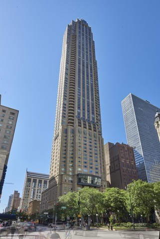 Spectacular half floor at the Park Tower. This is a true 3 bedroom plus family room. First time on the market. Enjoy 3 balconies, 2 east and 1 west to enjoy glorious sunsets. Cooks kitchen with wall of windows facing large terrace that has water, gas hook up, electric, drain, & magnificent lake views over the historic Water Tower and Museum of Contemporary Art. Gracious entry leads to large living room dining room that have expansive lake views. Gas fireplace has architectural mantel. This very special condo was designed to flow gracefully and separates the formal space from private areas seamlessly. Both family room and 3rd bedroom have terraces. Tremendous opportunity to buy at the Park Tower and live in a masterpiece. Two garage spaces included in price as well as storage space.