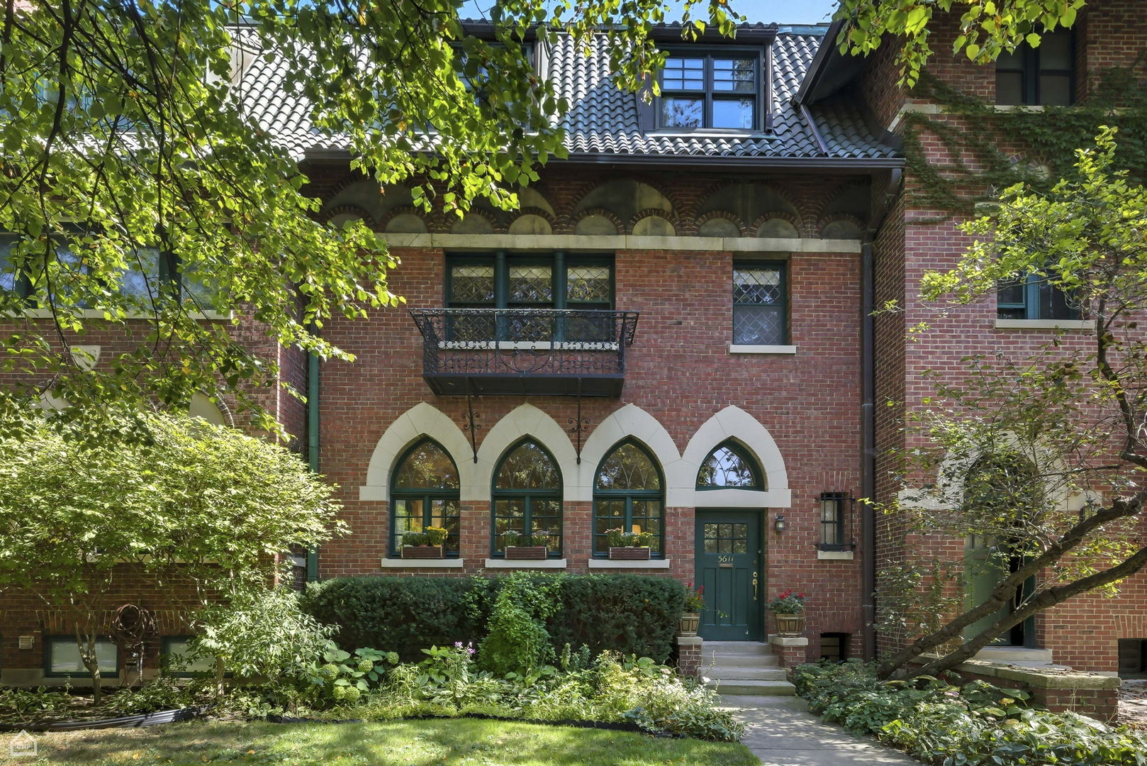 Nestled on a tree-lined cul-de-sac directly opposite Ray Elementary School playground, this prestigious rowhome was designed in 1903 by New York architectural firm Mann, MacNeille & Lindeberg in the classic Renaissance Revival style for University of Chicago academics and represents a rare opportunity on Hyde Park's storied Professor's Row. Beyond the stunning and well-preserved Gothic arched windows, this picturesque residence has been thoughtfully updated for modern living while preserving its profound historic character; offering six bedrooms, three and a half renovated baths, three wood burning fireplaces and an updated kitchen with Sub-Zero and Bosch appliances. The rear veranda and storybook backyard are a gardener's dream. The finished lower level provides exceptional utility with epoxy flooring, a workshop, laundry center and newer mechanicals. The third floor storage room and attic are a testament to the home's abundant space. This architecturally significant, once-in-a-generation offering is within the University of Chicago campus and near everything that Hyde Park has to offer.