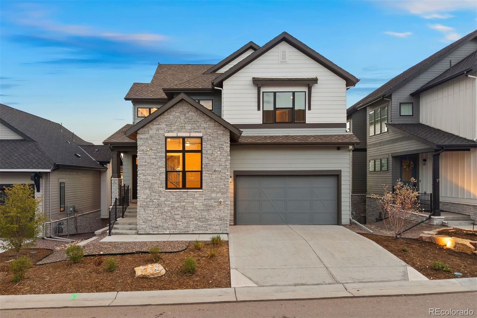 Detached single family, newer construction and entry-level pricing in the most sought-after gated golf community, south of Denver. The Village at Castle Pines delivers a lifestyle that’s hard to match. Beautiful pines and mountain views surround the two beautiful golf courses winding through the community. Panoramic front range views anchor every level, from the open main floor to the primary suite, and thoughtful upgrades throughout deliver exceptional value and style. Stylish, durable luxury vinyl plank flooring flows through the main level, where the great room centers on a floor-to-ceiling tile fireplace with floating mantle and built-in shelves that keep wires and media consoles out of sight. In the kitchen, a brand-new insulated sliding door opens to the upper deck, bringing the mountain views into the large granite island with breakfast bar. Stainless steel appliances and white soft close cabinetry and textured tile backsplash make this kitchen feel luxury, with a pantry rounding out the expansive storage. Upstairs, clerestory windows flood the loft with light and connect three bedrooms, including the primary suite, where mountain views compliment the spa like ensuite, featuring dual separate vanities, a glass enclosed walk-in rain shower, and dual walk-in closets.  The finished basement adds a fourth bedroom and full bathroom, alongside a recreation space with a wet-bar and walk-out to the back patio. ADDITIONAL FEATURES: A whole-home water filtration and softening system, air purifier, built in speaker system, and an oversized garage with brand new epoxy floors and motorized overhead storage. The Village at Castle Pines offers miles of trails, a pool, and a fitness center within the gates. Castle Rock's shops and restaurants are just minutes away, and easy I-25 access means Denver is just within reach.