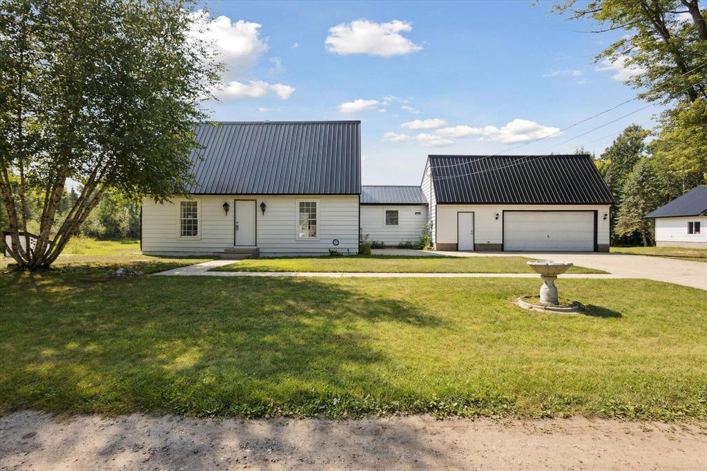 Ready to escape the ordinary? This completely renovated home on 4+ acres is your ticket to private waterfront living, just a stone's throw from Houghton Lake. With over 1900 square feet, 3 bedrooms, and 2 full bathrooms, everything inside has been updated-new floors, fresh paint, freshly updated kitchen, and fully remodeled bathrooms-leaving you with nothing to do but move in and enjoy. The real showstopper? The 1-acre, spring-fed pond stocked with rock bass, featuring turtles as well. It's your own personal paradise, right in your backyard. With Houghton Lake less than a mile away, you're minutes from 20,000 acres of water and 32 miles of shoreline, offering endless possibilities for boating, fishing, or just getting away from it all. Backing up to state land, this property offers unrivaled privacy and access to nature. Let's not forget the 2-story HEATED additional garage with an enormous amount of space. This could serve as an excellent wedding venue and AirBnB!Perfect for those who need room to work, play, or store their toys. Need even MORE space? For the right offer, you could snag a package deal for 20 additional acres right across the road. If you're looking for an INCREDIBLE home that combines peaceful seclusion with endless adventure, this is it. Don't wait- this RARE kind of opportunity doesn't come around often!