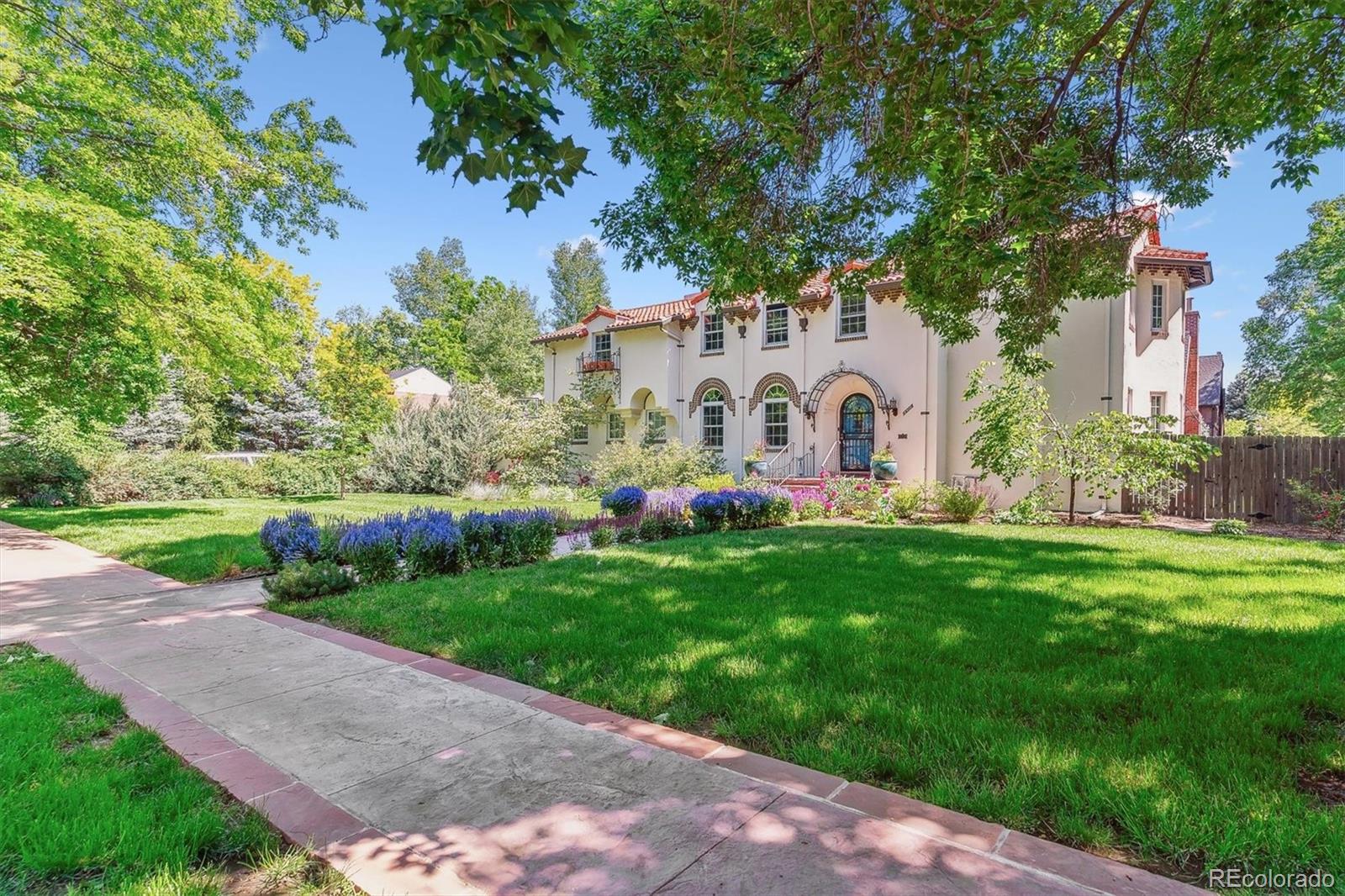 Introducing the exquisitely restored Bitman Hower House a landmark residence where historic craftsmanship meets elevated modern living. This Spanish Eclectic home is set within the treelined streets of Park Hill, one of Denver’s most architecturally significant neighborhoods, this home offers a rare blend of heritage, sophistication, and resort style amenities. A meticulous renovation brings new life to the home’s original character. The chef inspired kitchen with beautifully designed pass-through, refined finishes and premium updates, while the restored period baths highlight timeless design with modern comfort. The second-floor hosts four beautifully appointed bedrooms, including an expansive primary suite with French doors opening to a private balcony an elegant retreat for morning coffee or evening relaxation. The main level is anchored by a grand living room with an impressive historic fireplace, complemented by a sun-filled den ideal for a refined home office or library. The finished lower level extends the home’s livability with a generous recreation room designed for entertaining, media, or leisure. filled den ideal for a refined home office or library. The finished lower level extends the home’s livability with a generous recreation room designed for entertaining, media, or leisure. Step outside to a private sanctuary featuring a saltwater pool and hot tub an exceptional luxury rarely found in historic homes. Whether hosting gatherings or enjoying quiet afternoons, the outdoor space offers a resort like experience in the heart of the city. A masterpiece of preservation and modern refinement, this iconic residence offers a truly elevated lifestyle in one of Denver’s most sought out neighborhoods.