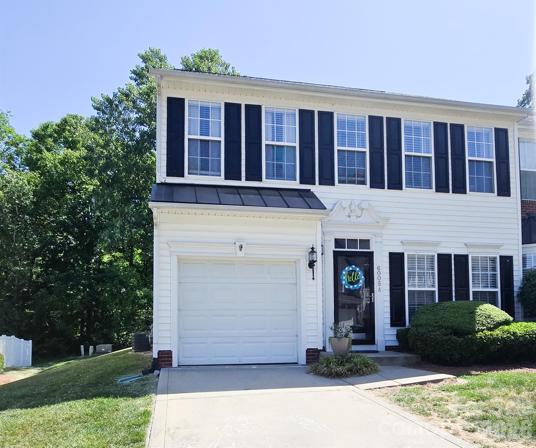 Location, convenience, style and comfortable living in this 3 bedroom 2 1/2 bath, 1 car garage, end unit townhome in Cramerton Village.  Beautifully maintained and tasteful decorator colors greet you as you enter the formal dining room. then the kitchen with granite countertops, stainless steel appliances and accent wall. Open living area with fireplace and sunroom with  french doors exiting to the privacy fenced backyard and patio. Half bath downstairs has updated vanity and shi plap. New pressure reducing valve enstalled 2023/24. Nice hardwood flooring through-out main level. Upstairs boasts of a spacious primary bedroom with tray ceiling , upgraded barn door,  luxury bath with garden tub and seperate shower. New tile in primary bath. Secondary bedroom upgraded with a lattice wall.New roof in 2023 (per iowner). New water heater in  2024? (per owner). Chill-out in the community pool or take the short walking trail to charming downtown Cramerton and Goat Island Park.