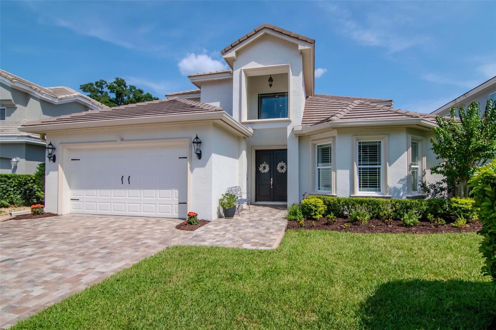 We are pleased to present this STUNNING, 2015 BUILT, 3 bedrooms, a study and plus bonus room, 3-1/2 bath, 3,634 sq. ft. home in Cheval! This model-like property features a light and bright open floor plan with volume ceilings; a SPECTACULAR KITCHEN with 42" custom cabinetry, granite countertops, stainless steel appliances, new 5-burner island gas cooktop (2021), double ovens, drawer microwave and walk in pantry; spacious bedrooms (MAIN FLOOR PRIMARY BEDROOM); a BEAUTIFUL PRIMARY BATHROOM with large shower (dual shower
heads), freestanding garden tub and dual master closets; all secondary full baths with custom cabinetry and granite countertops; MAIN FLOOR ALL TRAVERTINE and WOOD-PATTERNED TILE on second floor; tray ceilings; PLANTATION SHUTTERS and ELEGANT CROWN MOLDING throughout; 5-1/2 inch baseboard throughout; gas fireplace; a HEATED SALT WATER POOL with brick paver decking and newly re-screened enclosure (heat pump pool heater installed 2020, new salt cell 2021, new variable-speed pool pump 2023); 2 HVAC systems and tankless hot water heater; security system; laundry room with custom cabinetry and sink; large closets that provide great storage; oversized 2 car garage with epoxy floor finish (2019) and overhead storage racks; a brick paver driveway (2020),
walkway and porch and much more! Cheval has 3 convenient entry gates, all of which are staffed 24 hours a day, seven days a week. Cheval also offers easy access to the newly renovated Cheval Golf Club and Athletic Center and the new Cheval golf course opening in
November, and to the adjoining TPC Club. Add to these GREAT SCHOOLS, a community park/playground and a convenient location for shopping and interstate travel and you have a fantastic place to call Home.

Enhanced energy efficiency and quietness with new (November 2024) HVHZ (Miami-Dade)
impact French doors with internal shades and blackout drapes going from master bedroom
to pool.

Other energy improvements include changing all ceiling fans to new remote-control fans
with LED lights, upgrading almost all light fixtures throughout the house to LED, installing a
new variable-speed Energy Star rated pool pump, improving attic insulation to R38,
installing radiant barrier, and adding R30 insulation over garage.

As a precaution against potential prolonged power outages without worrying about the
availability of gasoline, installed a generator inlet port with manual interlock (connects
generator to circuit breaker panel) and an extended natural gas line to connect the included
portable tri-fuel generator capable of powering most critical electrical equipment.