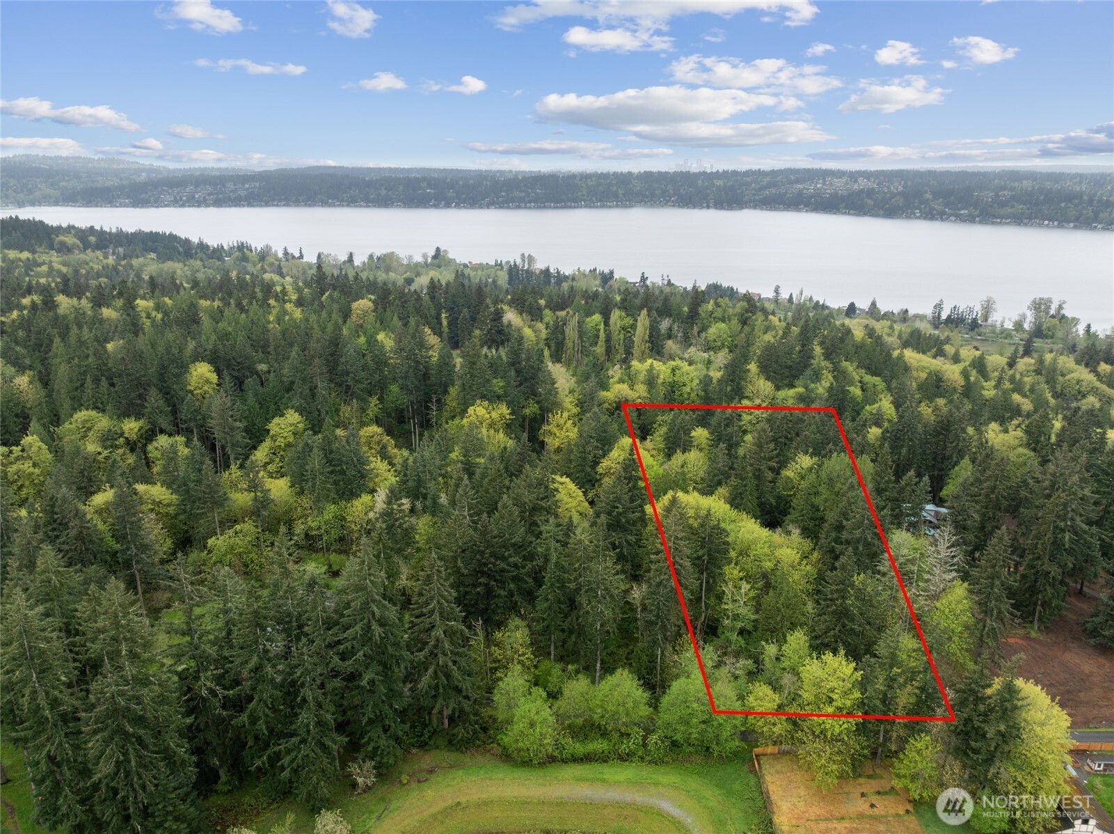 Rare opportunity to own a private 3-acre retreat in the heart of Sammamish, offering exceptional flexibility for both luxury living and investment potential. Tucked away in a serene natural setting, this expansive property features seasonal views of Lake Sammamish, depending on your building site and thoughtful design. All utilities are on site, with sewer conveniently available at the street. Zoned R1, the property presents a compelling opportunity to build a custom estate or explore subdivision into two lots (buyer to verify), maximizing long-term value. The existing home is a fixer-upper, and the land is the primary value. Ideal for builders, investors, or end-users seeking privacy, space, and upside potential. Enjoy easy access to Redmond and Issaquah, along with top-rated schools in the Lake Washington School District. A rare combination of acreage, location, and opportunity in one of the Eastside’s most desirable communities.