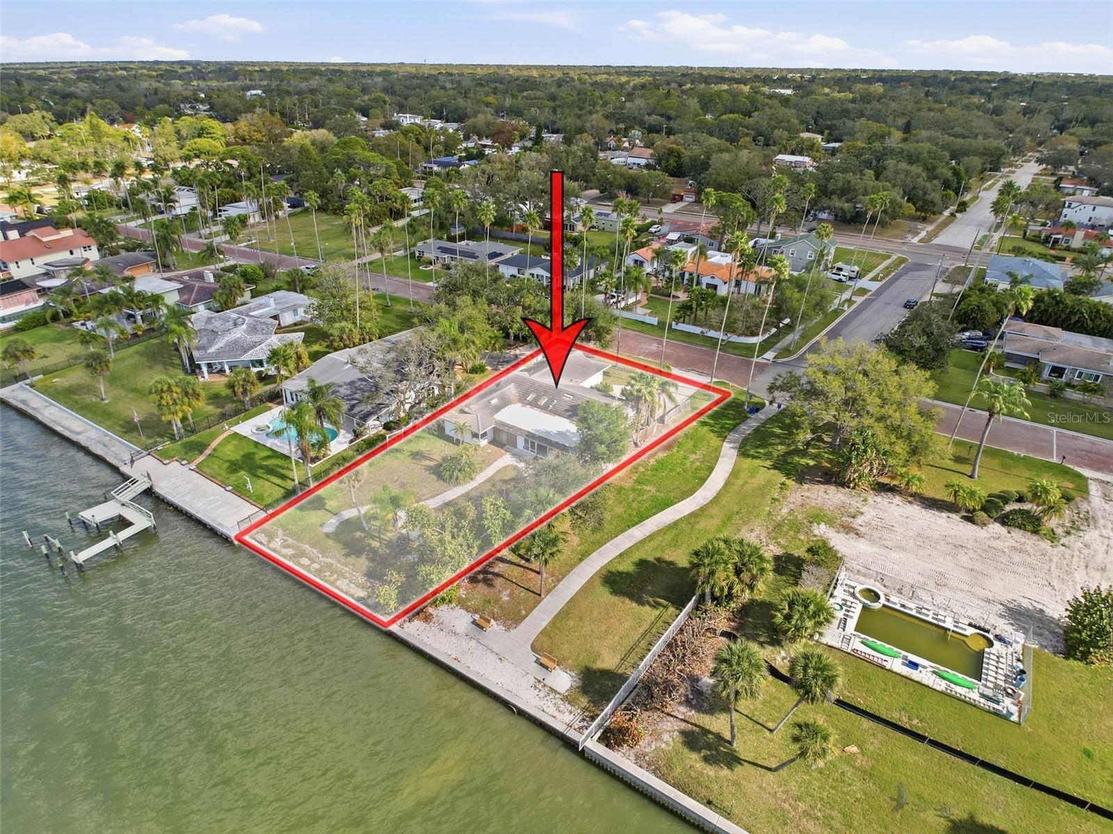 A rare opportunity to own a premier Dunedin Waterfront property. Envision your forever home on this 70 Foot waterfront lot with panoramic views of St Joseph Sound, Intercoastal Waterway, and the Gulf of America. If that "Salt Life" isn't enough, you are buying into the vibrant Dunedin lifestyle. Cobblestone streets, walking and biking on the Pinellas Trail, a downtown offering a wide variety of dining experiences, boutiques, and home decor shops.  Hop over to Caladesi Island State Park and Honeymoon Island for a day at the beach and great shelling. This home was impacted by Hurricane Helene and is being sold for land only. All impact fees convey with the property.