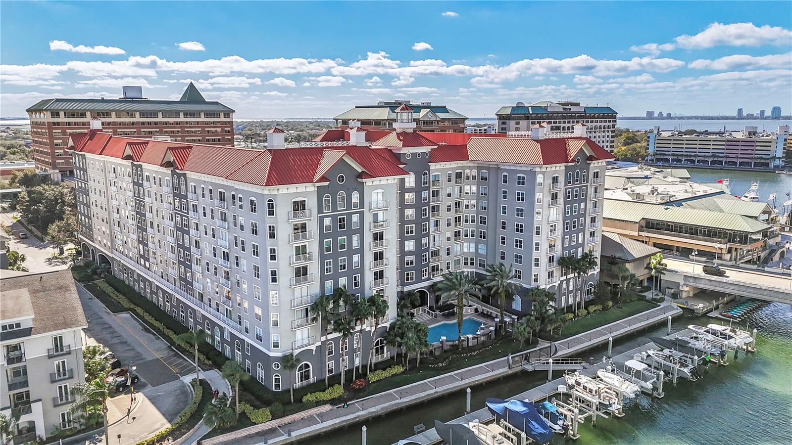 Experience sophisticated urban living in the exclusive enclave of Harbour Island at 700 S Harbour Island Blvd #240. This elegantly designed residence offers an open-concept layout, flooded with natural light and featuring a charming Juliet balcony with a peekaboo view of the Garrison Channel. It’s important to note that this side of the building is especially quiet, giving you the best of both worlds—right in the heart of Harbour Island, yet able to enjoy peace and relaxation whenever you need it.

The stylish living area flows seamlessly into a gourmet kitchen, complete with stainless steel appliances, sleek finishes, and ample space for both entertaining and culinary creativity.

The owner’s suite is a private retreat, boasting a spa-inspired ensuite bath and a custom walk-in closet for ultimate comfort and organization. A versatile second bedroom is perfect for guests, a home office, or a personal sanctuary.

Additional perks include two parking spaces—one assigned and one with a parking pass in the secured garage. The designated parking space is just a few steps from the building entrance and the condo unit!

Residents enjoy a wealth of premium amenities, including a resort-style pool, state-of-the-art fitness center, and 24/7 on-site security. Just minutes from downtown Tampa, this prime location offers easy access to upscale dining, entertainment, and cultural hotspots—all while providing a tranquil escape along the water.

Downtown Proximity: Just a short walk or drive to downtown Tampa, including Water Street, Amalie Arena, Sparkman Wharf, and the Tampa Riverwalk.
Dining & Entertainment: Steps away from upscale restaurants, cafes, and bars, including Jackson’s Bistro, American Social, and The Sail Pavilion.
Convenient Transportation: Easy access to Channelside Drive, Bayshore Boulevard, I-275, and the Crosstown Expressway, making it simple to commute or explore the area.
