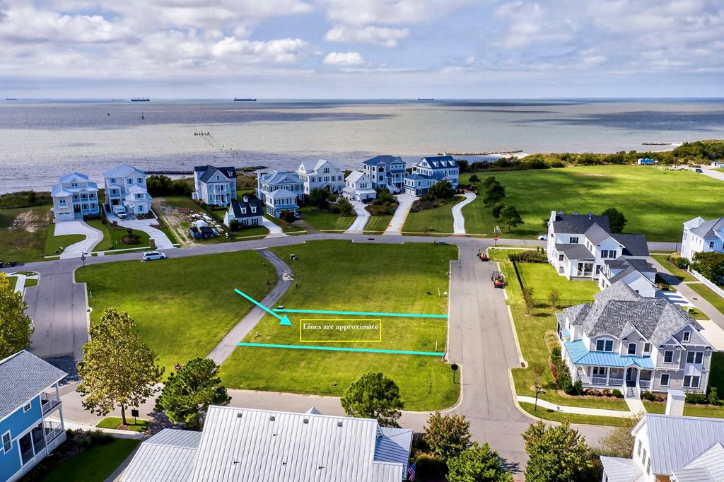 Lot 139, a prime building opportunity in the desirable Bayside Village 1 neighborhood of Bay Creek. This spacious lot offers the perfect setting to create your dream home with no time frame to build—giving you the flexibility to plan at your own pace. Located close to the Beach Entrance of Bay Creeks private 2 mile beach. Further, you'll be surrounded by world-class amenities, including access to the Member Life Center, offering fitness facilities, an outdoor pool, and wellness programs and so much more. Bayside Village 1 is one of the most limited, sought-after neighborhoods within Bay Creek, and with only a few lots remaining!