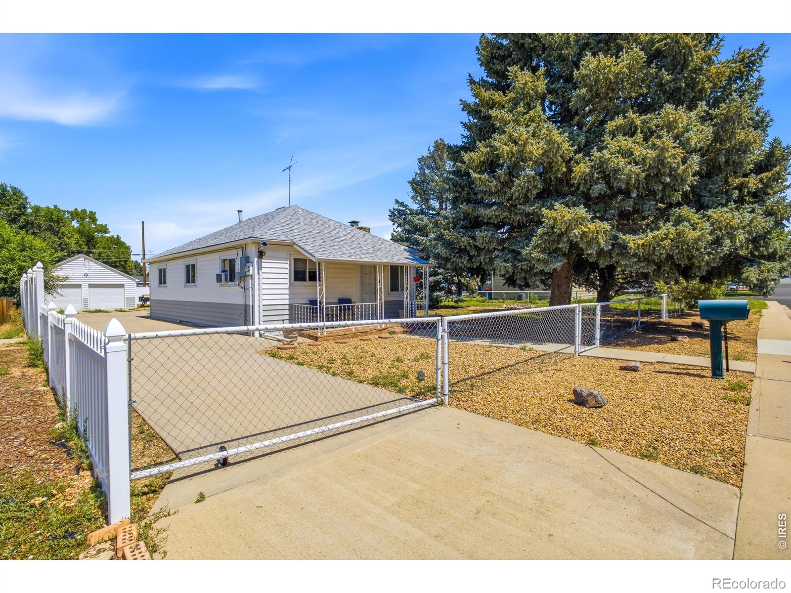 A rare find with more than a century of Dacono history! This 2-bedroom, 1-bath home sits on a fully fenced property with TWO lots-giving the next owner options that are increasingly hard to find. Enjoy the property as it is, explore adding an ADU, or look into separating the lots for a future homesite, resale, or a multigenerational setup with separate living spaces. Inside, a flex room can be easily closed off to be a 3rd bedroom, newer flooring throughout most of the home and an electric fireplace. Outside, mature trees add shade and character. The oversized detached 2-car garage/shop with EV charger and plenty of room for vehicles, storage, hobbies, or projects. No HOA adds even more flexibility. Property is currently tenant-occupied with a lease in place. Contact agent for additional details. Buyer to verify zoning, lot separation/subdivision requirements, ADU eligibility, building requirements, allowable uses, and development options with the appropriate municipality.