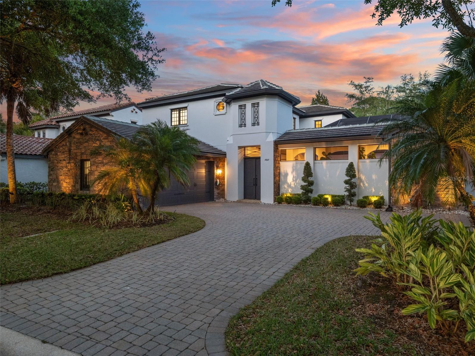 Welcome to 9849 Covent Garden Drive, a fully renovated courtyard pool home in Lake Nona Golf & Country Club. Offering 4 bedrooms, 4.5 bathrooms, and 3,330 square feet, this home has been renovated by Maroon Fine Homes in 2025 and showcases timeless design, high-end finishes, and exceptional craftsmanship throughout.The open-concept layout seamlessly connects the kitchen, dining, and family room, creating an effortless flow for both everyday living and entertaining. The chef’s kitchen features Wolf and Sub-Zero appliances, custom cabinetry with lighted glass upper cabinets, a large center island, and double dishwashers. A standout wet bar with an ice maker, wine fridge, and beautiful lighted display shelving serves as a true showpiece, elevating the home’s entertaining experience.Designed around a private courtyard, the home embraces indoor-outdoor living with a pool, spa, and summer kitchen at its center, visible from multiple living spaces. The main-level primary suite offers a private retreat with dual walk-in closets and a spa-inspired bath featuring separate vanities and a freestanding soaking tub.Upstairs includes three additional bedrooms, three full bathrooms, and a versatile loft, ideal for a secondary living space, office, or playroom. A screened, covered lanai and built-in fire pit extend the outdoor living experience.Located within the gates of Lake Nona Golf & Country Club, recognized as a Platinum Club of the World, this home offers access to one of Central Florida’s most sought-after communities, just minutes from Orlando International Airport, major highways, and world-class dining, shopping, and entertainment.Turnkey, refined, and move-in ready, this is Lake Nona living at its finest.