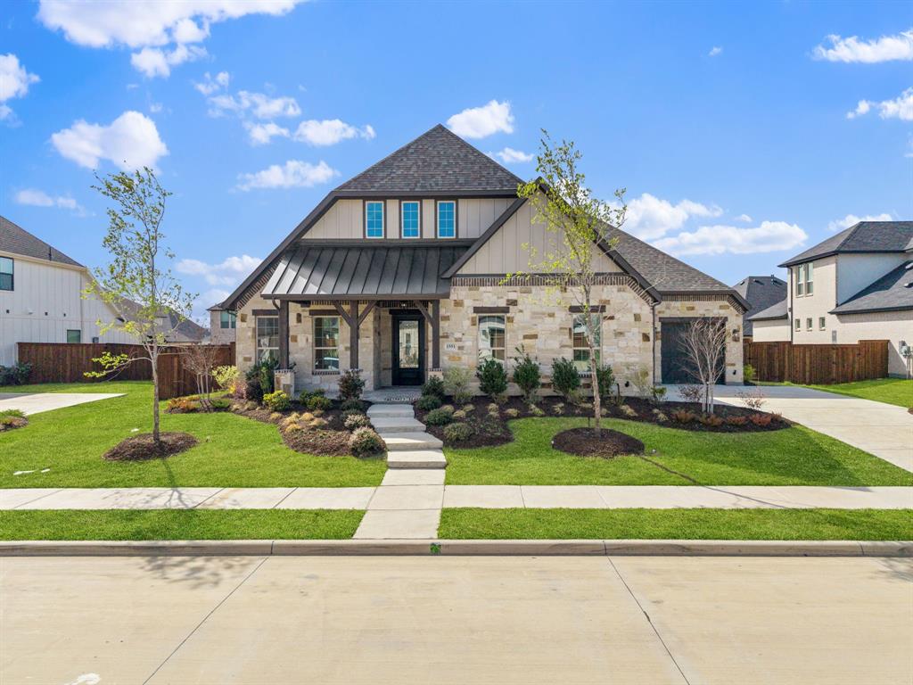 RISLAND HOMES ARIYA floor plan.  Honey turn the car around!  Rare 4-bdrm one-story!  Head-turning elevation crafted beautifully with brick, stone & cedar accents for this jaw dropping home located on an oversized 90’ x 140’ interior lot!  Remarkably wide foyer is embellished with tray ceilings & the perfect entry to decorate to greet your guests.  Turn toward the Gourmet Kitchen & indulge in luxury finishes, with SS KitchenAid appliances with Fridge, pot filler, morning kitchen with second sink, oversized pantry, and impressively sized waterfall island in the center of it all - simply chef's kiss!  The kitchen is open to the casual dining and Family Room.  Windows surround the common gathering spaces allowing an incredible amount of natural light to shine through.  Family room features a telescoping sliding glass door leading out to an ample sized patio & larger-than-life backyard!  Raise eyebrows with this primary suite!  Enhanced with gorgeous windows and a bath fit for anyone who loves to treat themselves.  Enjoy your own at home spa with the floor to ceiling tiled shower finished with rainfall shower head, traditional shower head, and built in seating.  Or grab some bubbly and get the bubbles going - relax while you soak all your worries away in the free-standing tub!  Hardwood floors are included throughout all common areas including foyer, owners' entry, hallways, kitchen, family room & casual dining.  Nice sized secondary bedrooms.  Heading out for the day?  Grab your coat at the mudroom on your way into the three-car garage where your electric vehicle has been on charge all night, thanks to the 220V 50amp power outlet that's included!  New Prosper ISD Elementary school opened Fall 2025 and is located within the community!  Enjoy the community amenities with clubhouse with meeting space and full kitchen, infinity pool, work out room, yoga lawn, playground, pond and walking trails.  See this home any time dawn to dusk with the NTER NOW system. READY NOW!