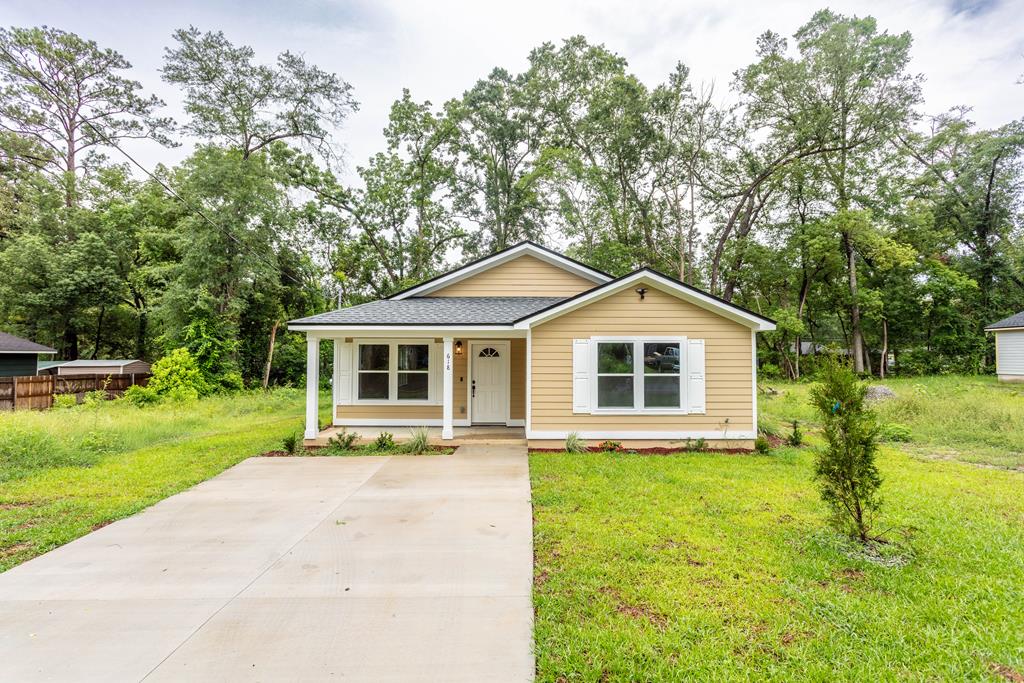 Brand new, spacious home in historic Dewey City! The beautiful new home is just filled with designer touches that make it one of a kind. Luxury vinyl flooring, and gleaming tile, make this home special from the floor up. Large family room with attached dinning room that adjoins chef's kitchen with open  floor plan. Kitchen features bar peninsula with  plenty of room for stools for additional seating at the granite countertop serving area. Kitchen also features stainless steel appliances, including refrigerator, range , built in microwave, and dishwasher. 3 large bedrooms with fabulous closet space. split floor plan with 2 bedrooms and dedicated bath at front of home with primary suite, complete with fashion ready built in shelving and lighting is ready for glamor and is also convenient. The ensuite bath features wonderful counter space and a dual vanity. Home features recess lighting , ceiling fans, and designer fixtures through out. Once outside the home, enjoy the beautiful landscaping, and gracious rocking chair front porch. Rear covered porch overlooks back yard with privacy fencing, and has super handy outdoor storage room. Home is perfect for indoor and outdoor entertaining and is all set for years of carefree living and precious memories ahead. Call for an  appointment for a personal showing. Qualifies for conventional financing, as well as FHA, USDA, VA . This home is a perfect blend of practicality and glamor, a MUST see!