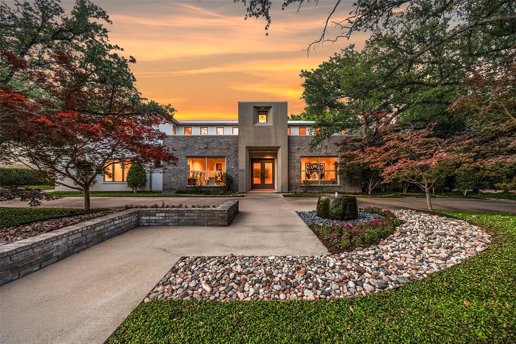 Perfectly positioned on the 16th hole of Bent Tree Country Club, this exceptional custom home offers over 7,100 square feet of luxury living on a 0.379-acre golf course lot. A circle drive, mature trees, lush landscaping, and two water features create a striking first impression, while the interior showcases thoughtful design, refined finishes, and modern functionality. The expansive layout includes five living areas, four bedrooms with en suite baths and custom walk-in closets, and three additional half baths. The gourmet kitchen is a chef’s dream with Sub-Zero refrigerator freezers, Thermador gas range with grill, griddle, and double ovens, double Thermador dishwashers, a Miele built-in coffee system, oversized island, custom cabinets, walk-in pantry, and built-in desk. Entertaining is effortless with three wet bars, a 700-bottle climate-controlled wine room, media room with built-in speakers, and multiple gathering spaces. The luxurious primary suite features a gas fireplace, spa-inspired bathroom with dual vanities, frameless shower, SOK soaking tub, smart bidet, and a boutique-style closet with built-in Viking safe and ironing board. A private laundry room and coffee bar with beverage fridge offer added convenience. Hunter Douglas automatic window treatments are found throughout the home. Enjoy panoramic golf course views from the backyard oasis with a sparkling pool, spa, covered patio, and a gourmet outdoor kitchen. Additional highlights include a metal roof with gutters and leaf guards, Lutron lighting, smart home systems including Nest and iAquaLink, Flo by Moen water shutoff, two tankless water heaters, updated HVAC units, fire suppression system, and a spacious three-car garage with built-ins.