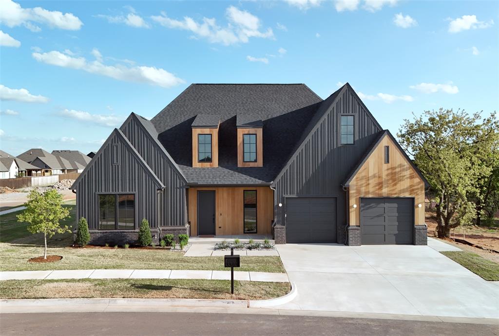 Set in Cross Timbers, this newly completed home was designed with intention from start to finish. The entry makes a statement right away with terra cotta flooring, warm wood beams, and clean lighting that sets the tone. There’s a dedicated pocket office that makes working from home feel separate but still connected. Even the utility room was given attention, with a full backsplash, apron-front sink, and cabinetry that actually makes the space feel finished. Two front bedrooms are positioned on this side of the home, along with a full bathroom. The main living spaces feel open and natural, with light pouring in and a mix of materials that actually work together—light wood floors, darker stone, soft cabinetry, and just enough contrast to keep it interesting. The kitchen is the center of it all, anchored by a sculptural vent hood and a large island. There are small moments throughout—open shelving, built-ins, and a clay tile screen detail, that give it personality without taking over the space. The primary suite carries the same tone, simple, calm, and well thought out. The bathroom stands out in the best way, with a freestanding tub set under a large window and natural light that keeps the space feeling soft. And the mirrors, easily one of the best details in the house. A little unexpected, a little playful, and just enough to make the space feel different from anything else you’ve seen. There’s also a powder bath that doesn’t get overlooked, it’s a moment. Terra cotta-toned tile wraps the vanity, paired with a stone vessel sink and a warm brass faucet that gives it just the right contrast. Clean lighting and simple lines keep it grounded. A versatile rumpus room adds flexibility—easily functioning as a fourth bedroom, second living area, or a space for movie nights and play. From the exterior materials to the interiors, there’s a consistency here that’s hard to find. Every finish, every texture, every detail was chosen with intention, and it shows.