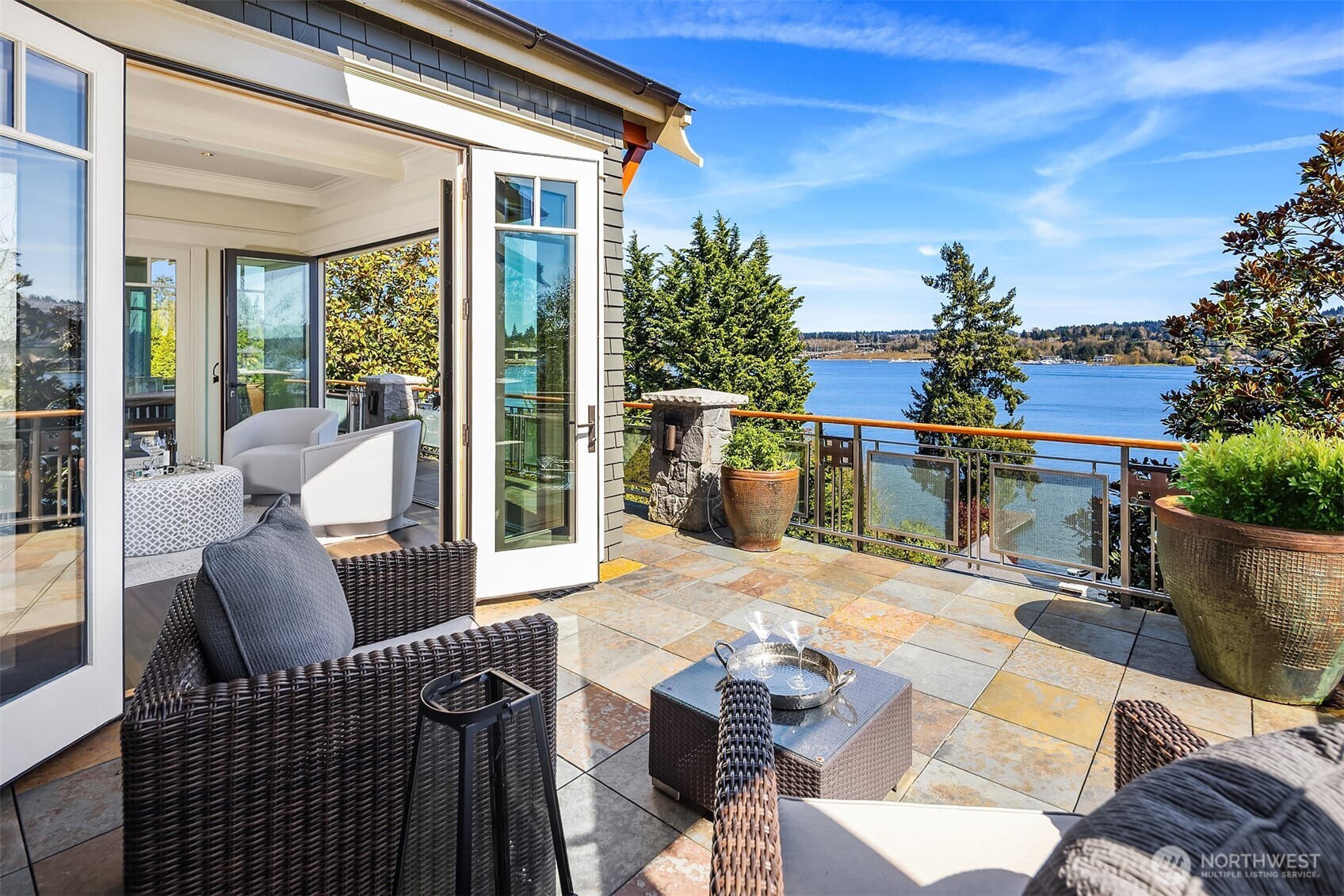 The main living space opens wide to this generous southern deck, capturing warmth, light and an easy connection to the outdoors.