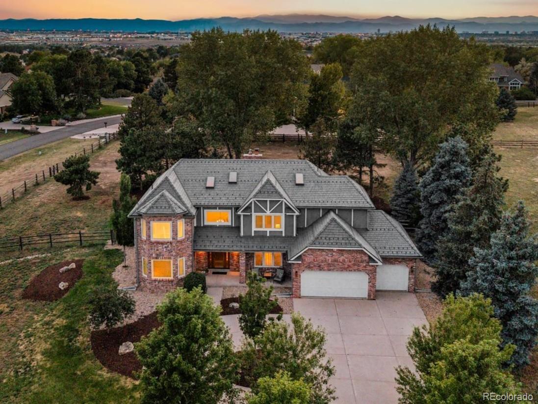 Welcome to luxury living in the coveted Chapparal neighborhood in Centennial, Colorado, where this fully updated 4-bedroom, 5-bathroom home sits on a pristine 1.18 acre lot and tremendous views of Pikes Peak. With numerous high-end updates and peaceful neighborhood amenities, the residence features a durable class 4 impact and class A fire rated DaVinci roof with a transferable warranty, custom engineered roof snow guards, high-efficiency Pella designer series windows with built in blinds, and a new septic system installed just weeks ago. The interior features newly installed Karistan carpet, freshly painted rooms, designer lighting, kohler fixtures, a full finished basement complete with a gas fireplace, theater area wired for Atmos sound system, fitness room, and a full bathroom. Built for culinary excellence, the gourmet kitchen boasts custom DeWils mahogany cabinets, a premium Wolf oven/range, a convection steam oven, Wolf microwave and ventilation hood, a spacious built-in Sub-Zero refrigerator, a Sub Zero wine refrigerator, all designed by Kitchens at the Denver. The primary suite serves as a tranquil retreat complete with a luxurious centerpiece Kohler cast-iron soaking tub, luxury travertine tile flooring, Kohler pedestal sinks, dual walk-in closets, and a complete space to relax at the end of the day. The upstairs is complete with three additional bedrooms, one with an en suite updated bathroom and the other two with a connected Jack and Jill bathroom which is also updated. Step outside to the private patio featuring a custom gas fireplace placed next to a large dining and sitting area with amazing mountain views. Situated within the highly acclaimed Cherry Creek School District and convenient to prestigious private options like Regis Jesuit High School and Our Lady of Loreto Catholic School, residents also enjoy exclusive access to community pool and tennis facilities. Schedule a private viewing today.