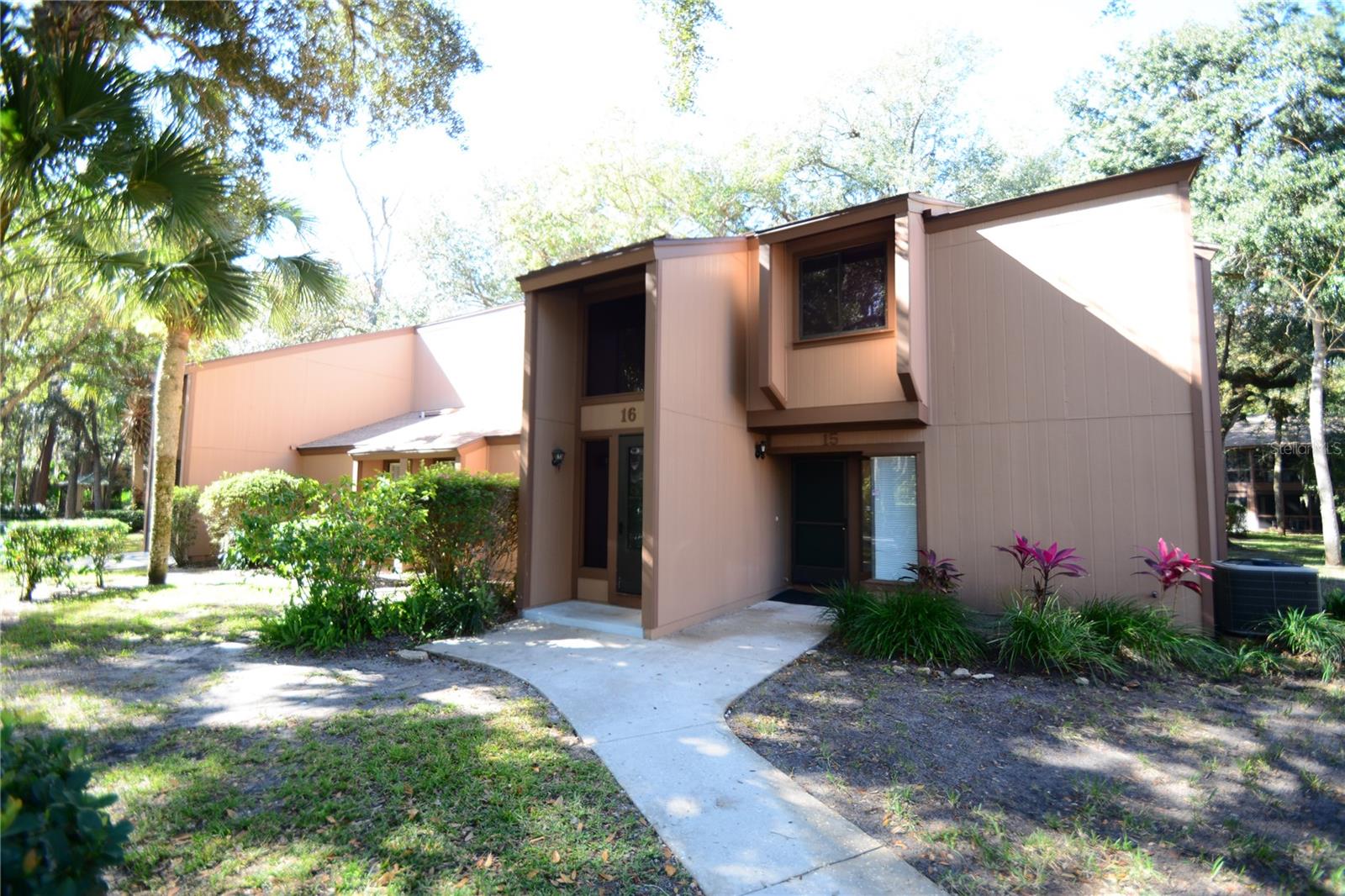 Affordable coastal living in the Fairways! This second-floor 2-bedroom, 2-bath condo at 16 Oakmont Court is priced among the lowest two-bedroom condos in the community. It sits minutes from Palm Coast’s beaches and directly across from Palm Coast Linear Park and the St. Joe Walkway, with miles of shaded walking and biking trails at your door. European Village, Palm Harbor Golf Club, shopping and dining are all close by.Inside, an open layout connects the kitchen, dining and living areas, with plank flooring throughout the main living space. The split-bedroom floor plan gives everyone privacy, and the generously sized primary suite has its own bath with a walk-in shower. An interior laundry area with washer and dryer adds everyday convenience. Step out to the large private balcony and enjoy a quiet, wooded view.The Fairways is a pet-friendly community with a pool [and tennis courts]. Whether you want a full-time home, a seasonal getaway or a low-maintenance Florida base, this condo delivers location and value. Easy to show, so schedule your visit today!