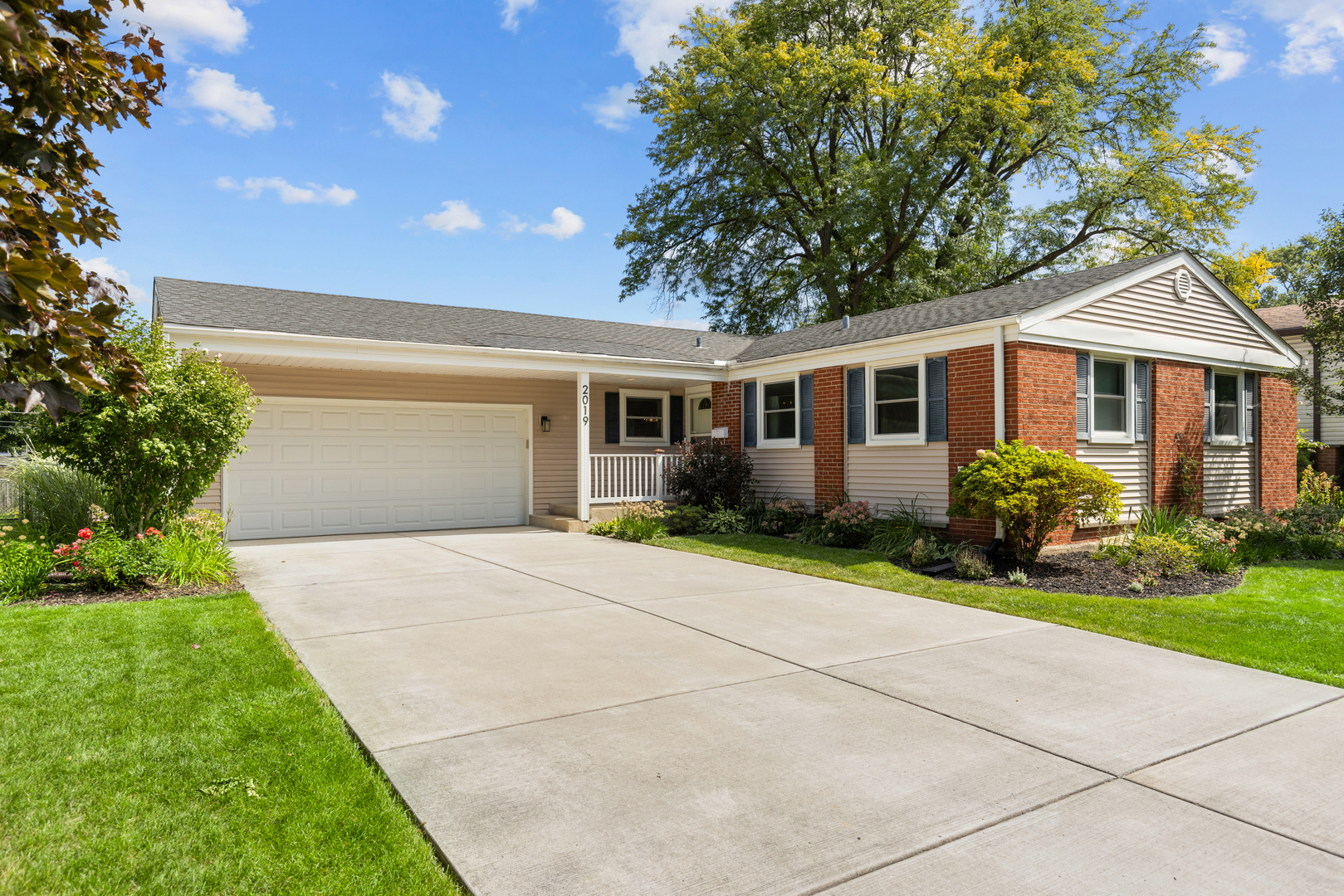 Welcome to 2019 N Verde Drive. This 4 bedroom, 3 bathroom ranch-style home has everything you need. Completely updated and move in ready from head to toe. Enter to the spacious main level, which features an open kitchen, dining and living rooms, plus three bedrooms and two full bathrooms. Hardwood flooring spans the entire home. The kitchen has been tastefully updated with a new fridge, stainless steel appliances, and marble countertops. A convenient mudroom leads into the attached two car garage. On the other end of the home lies three bedrooms, including a primary oasis complete with an updated en suite bathroom with marble shower and new vanity. Two additional bedrooms and a second bathroom round out this floor. Heading down the stairs, you'll find a finished basement with great ceiling height, plenty of space for a second family room, workout area, playroom, and the 4th bedroom. The lower level also has a 3rd full bathroom, adding functionality and convenience to the space. Many updates have been made including: roof ~2015, windows 2018, water heater 2024, HVAC 2015, driveway 2016, siding 2016, patio 2020, deck 2017 and more. All of this in an amazingly walkable location. Less than a 5 minute walk to top rated Greenbrier Elementary school, surrounded by multiple parks including Happiness and Frontier with soccer fields and a pool, and sneaky close to the highway making commutes a breeze. Come see for yourself today!