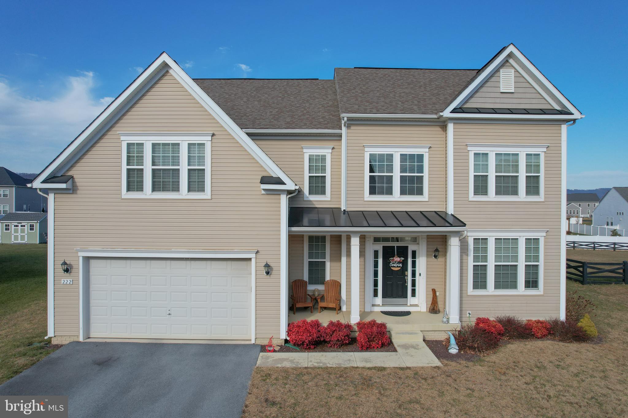 This beautifully upgraded 4-bedroom, 2.5-bath residence in the mountain view Springdale Farm community offers a rare blend of thoughtful design, timeless finishes, and room to grow—all without the wait or uncertainty of new construction.From the moment you step inside, the home makes a confident statement. Hardwood floors span every level—no carpet anywhere—setting the stage for easy living, durability, and enduring style. A sun-washed two-story foyer welcomes you in, opening to an open yet intentionally defined layout that flows effortlessly from room to room.At the heart of the home, the unique gourmet kitchen is a true standout. A massive, nearly 12-foot island anchors the space, offering seating for five and becoming the natural gathering place for everything from weekday breakfasts to holiday celebrations. Farmhouse-inspired finishes, custom lighting, a touch-activated faucet, stainless steel appliances, and abundant counter space create a kitchen that is equal parts beautiful and hardworking. The corner pantry, complete with custom shelving and a charming etched glass door, adds both function and personality. Just beyond, the sun-drenched morning room with oversized windows expands the living space even further—because there’s no such thing as too much room to gather.The adjoining family room feels both cozy and connected, featuring custom wood built-ins, recessed lighting, and an abundance of natural light. It’s a space equally suited for quiet evenings at home or effortless entertaining. A flexible front room on the main level offers endless possibilities—formal dining, sitting room, second living space, or a home office tailored to your needs. Additional main-level highlights include an oversized two-car garage with remote access, interior entry, and a thoughtfully designed mudroom with custom storage—because real life deserves beautiful organization, too.Upstairs, hardwood floors continue throughout. Three generously sized secondary bedrooms share a well-appointed full bath with double vanity, while the second-floor laundry adds everyday convenience right where you need it. The primary suite is a true retreat, offering a tray ceiling, ceiling fan, and two walk-in closets (because sharing is optional). The spa-inspired ensuite features a tiled shower and soaking tub wrapped in warm, neutral tones that feel both calming and timeless.The unfinished walk-up basement opens directly to the backyard and is brimming with potential—ready to become a future rec room, home gym, guest suite, creative studio, or all of the above.Outside, a large stamped concrete patio extends the living space outdoors, providing the perfect backdrop for grilling, relaxing, and enjoying the peaceful setting.Located just minutes from Winchester, Virginia, and within a comfortable commute to the DC Metro area, Springdale Farm offers an active, welcoming neighborhood and exceptional value for the lifestyle it delivers. Schedule your showing today.