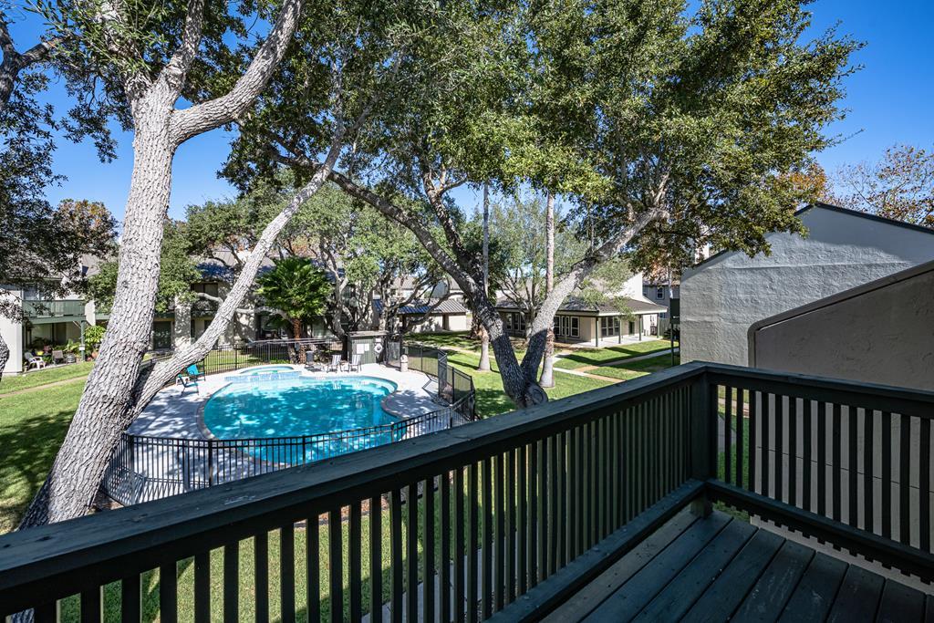 Pool views and relaxing feeling this condo in the prestigious Gardens of Lakeside at Rockport Country Club has it! Boasting an exceptional view of the sparkling community pool. The thoughtfully designed layout features downstairs a cozy living-dining space with wood burning fireplace adds to the relaxing vibe, while enjoying morning coffee on the patio overlooking the community pool,  and half bath for guests convenience and as you go upstairs your retreat with two bedrooms and a full bath. Located in a private 18 holes golf community, you're just a short drive to Rockport's pristine beach, vibrant shops, delicious restaurants, world-class fishing bays, and scenic Hike & Bike trails. Embrace the Rockport-Fulton lifestyle and make this your fulltime or second home coastal haven!