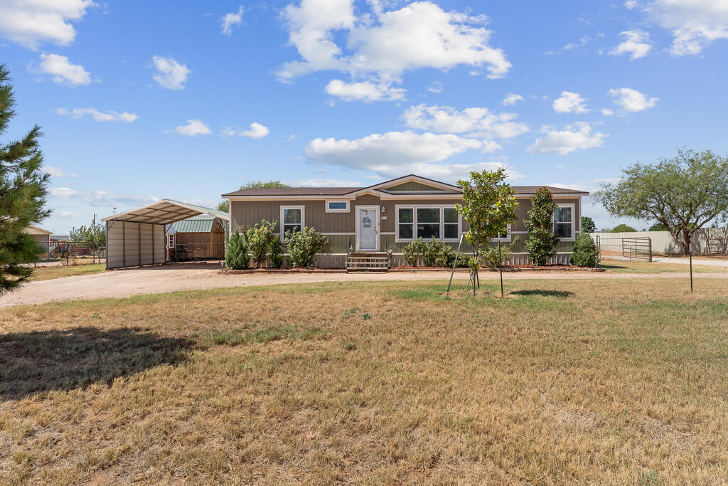 Unique opportunity in Greenwood! This approx. 7.45-acre property offers space, privacy, and versatility. Features include a 2019 double-wide home, 14 RV hookups, 2 horse stalls, 2 carports, and a private water well. Approx. 2.2 acres around the home and RV area are enclosed with metal fencing. The RV area has separate septic and electrical service. Ideal for a residence, horses, outdoor living, or additional income potential. Schedule your private showing today!
