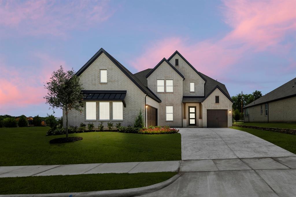 MLS# 21325551 - Built by RockWell Homes - Ready Now! ~ The Edward home plan on an over-sized 70-foot wide homesite offers a luxurious design with 4 bedrooms, 3 full baths, 2 half baths, private study, media room, game room, and three-car garage. The striking exterior features full brick with stone accents, metal roof details, buff mortar, dual-pane energy-efficient windows, covered front porch, covered patio, 8-foot front door, and wood garage doors. Upon entry, you’re welcomed by a foyer with soaring ceilings and elegant open-stair railing staircase, flanked by a private study and media room. The open-concept family room showcases soaring ceilings, abundant natural light, and a corner fireplace with views of the private backyard. The chef’s kitchen features a butler’s pantry, spacious walk-in pantry, solid surface countertops, undermount sink, ceramic tile backsplash, GE stainless steel built-in oven, gas cooktop, custom vent hood, dishwasher, recessed can lighting, Delta faucets, upgraded flooring, and 42-inch cabinets. The private primary suite offers a tray ceiling, ceiling fan, dual vanities, ceramic tile flooring, oversized ceramic tile shower with semi-frameless glass enclosure, free-standing garden tub, linen closet, private water closet, and large walk-in closet. A secondary first-floor bedroom includes a private ensuite bath with ceramic tile flooring and tub-shower surround. Upstairs features spacious secondary bedrooms with oversized walk-in closets, well-appointed baths, and an over-sized game room ideal for entertaining or second living space. Additional highlights include mud bench-drop zone, over-sized utility room with ceramic tile flooring, fenced backyard with gate, sprinkler system, full gutters, tankless water heater, energy-efficient HVAC, smart home features, garage door openers, abundant storage, full landscaping package, new home warranty, and energy-efficient construction wrapped in full brick for lasting durability and style.