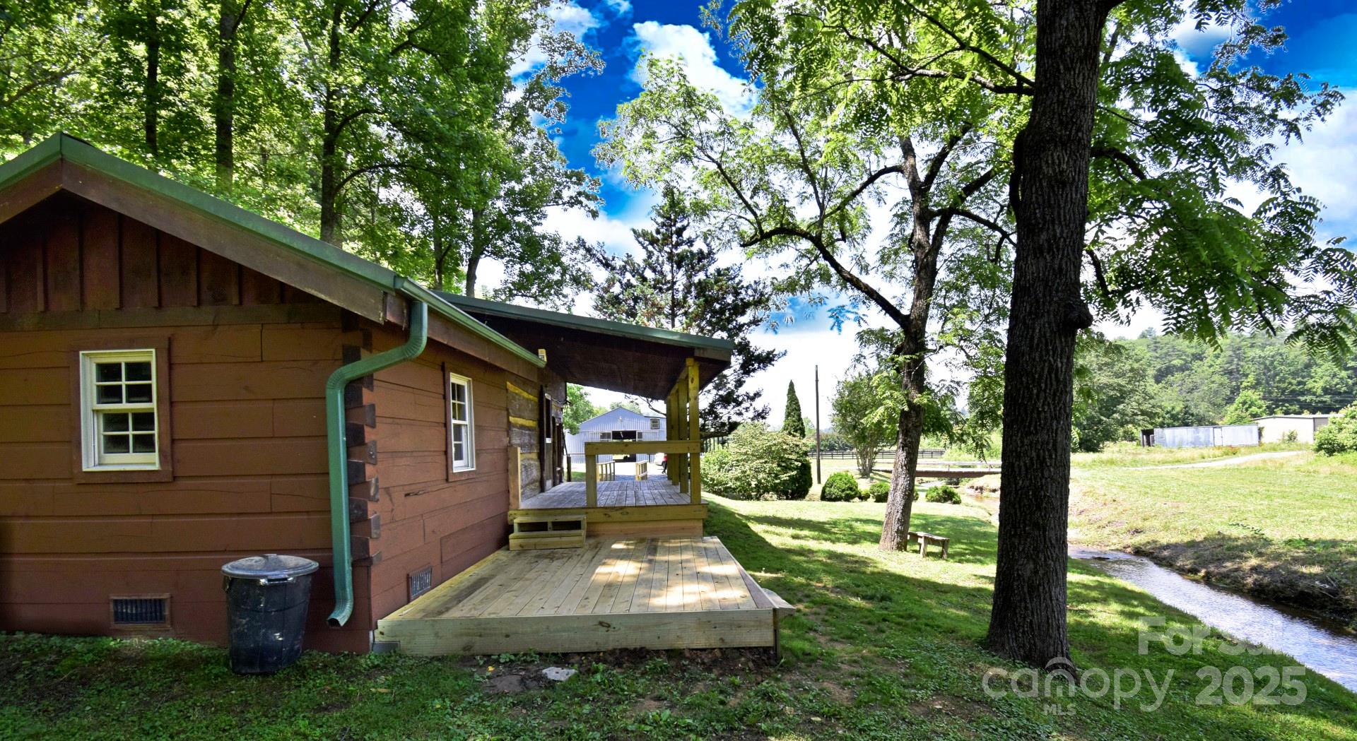 This is the equestrian, sportsman, adventurist, privacy seeking, creek loving, family compound, room to expand, mountain view, dream property that is becoming impossible to find in ever growing western North Carolina.   You can hunt and enjoy the privacy of the 81 acres or ride horses all day on the nearby blue ridge horseman's association trails.  At the and of that long day enjoy fine dining in Blowing Rock within 30 minutes of the home.  The property is bordered by mulberry creek on the north side and includes a confluence with another small creek runs through the acreage.  The property includes a totally renovated 2 bedroom 1 bath cabin with a great rocking chair front porch to take in the sounds of the creek or watch the kids play.  Also included is a 40x100 horse barn that featuring a 1 bedroom apartment with kitchenette and bath for true barn dominium living.  The barn also features a riding ring, 6 stalls with water, tack room, and a new roof.