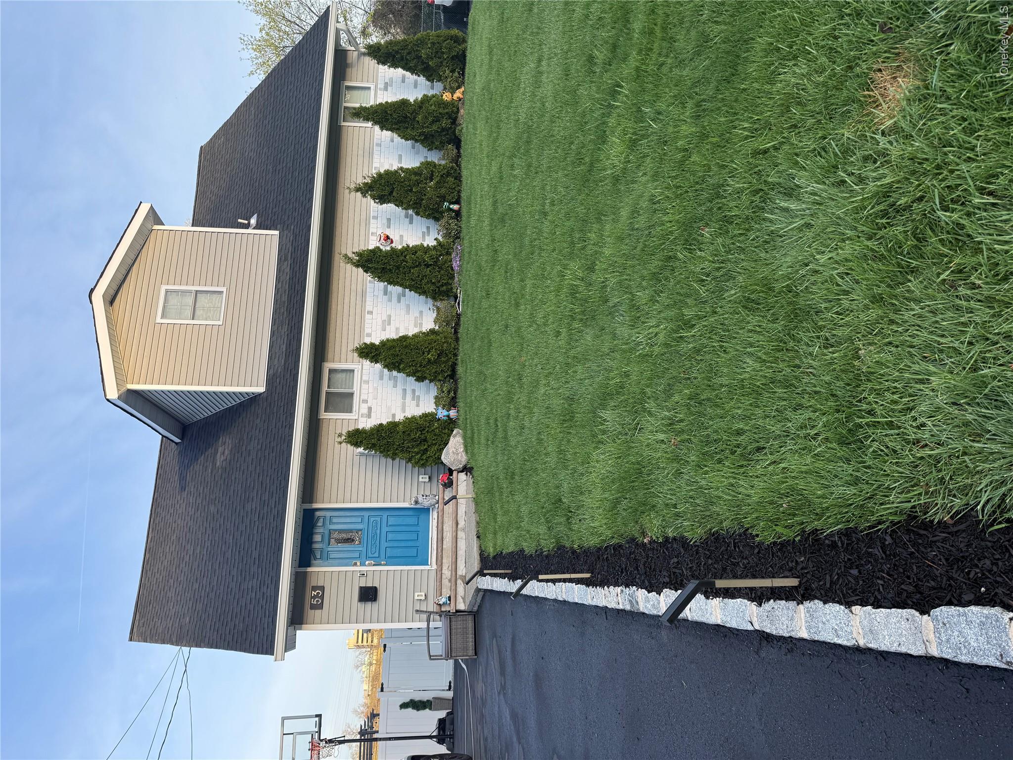 Welcome to 53 Hazelton Road, a beautifully updated 4 bedroom, 2 bath Cape Cod in the peaceful Westview neighborhood of Yonkers. Set on a generously sized lot, this home blends classic charm with modern upgrades and space to truly live. The fully renovated kitchen is a standout feature, designed in a striking two tone palette with crisp white upper cabinetry and rich navy blue lower cabinets. Completely open to the main living area, it offers seamless flow for everyday living and entertaining. A massive center island anchors the space, perfect for gathering, meal prep, or morning coffee. Brand new stainless steel appliances complete the look with style and function. Natural light pours into the inviting living room, highlighting the floors and thoughtful updates throughout. The main level includes two comfortable bedrooms and a full bath. Upstairs, you will find two spacious additional bedrooms ideal for guests, a home office, or creative space. The full unfinished basement provides excellent storage, laundry space, and future potential. Step outside to an expansive yard that truly sets this home apart. With plenty of room to entertain, garden, play, or relax, plus a large storage shed, this outdoor space is ready for summer barbecues and year round enjoyment. A private driveway fits all vehicles, and the location offers easy access to shopping, parks, schools, major roadways, and public transportation. 53 Hazelton Road delivers space, style, and convenience all in one inviting package.