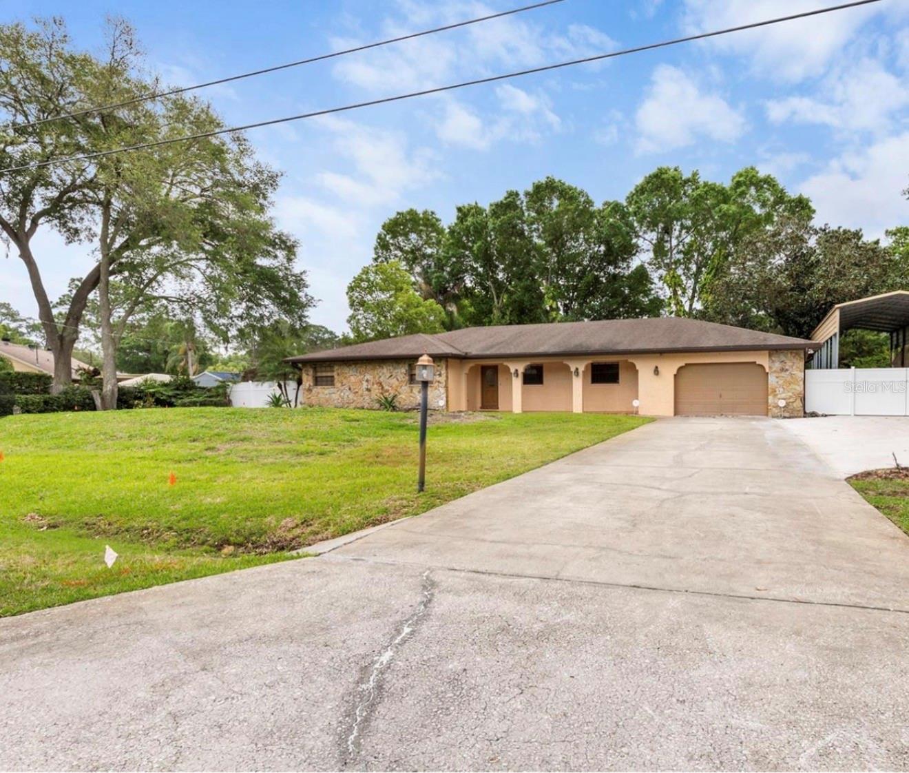 Awesome Property! So much curb appeal and the opportunity to live in this the desirable Pat Acres subdivision of Tampa. Spacious home , New Kitchen with island generous living space is move-in ready. . Lots of room to roam the beautiful oversized yard that is perfect for pets, set off by plenty of mature trees and landscape.
