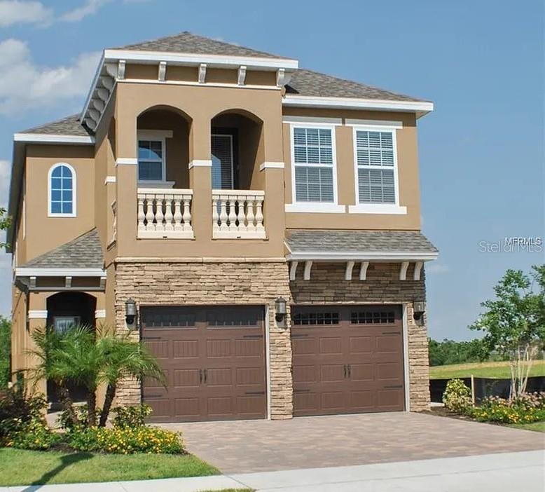 Located in the world-renowned Reunion Resort, 795 Golden Bear Drive is a stunning 5-bedroom, 5.5-bathroom luxury villa that blends sophisticated transitional design with an unparalleled entertainment experience. Professionally decorated with vibrant Florida-inspired colors, this Crestview model serves as an ideal primary residence or a high-performing vacation investment property.Luxurious Living SpacesThe open-concept floor plan creates an inviting atmosphere for gathering.Gourmet Kitchen: Features solid wood cabinets, high-end stainless steel appliances, granite countertops, and a center island with a breakfast bar.Master Suites: Includes three spacious King en-suites, with the primary master located conveniently on the first floor.Guest Bedrooms: Two additional bedrooms feature custom reading nooks and private attached baths.Elite Entertainment WingDesigned for the ultimate guest experience, the home features dedicated spaces for fun and relaxation.Private Home Theater: A fully air-conditioned, 9-seat theater with a massive 150" projection screen.Loft Game Room: A vibrant space complete with foosball, air hockey, pinball, and classic arcade machines.Outdoor OasisStep outside to a south-facing backyard designed to maximize the Florida lifestyle.Heated Pool & Spa: A 21x17 heated gunite pool and bubbling spillover spa overlooking the lush pond and golf course views.Summer Living: The shaded patio includes a natural gas grill connection, perfect for al fresco dining against the backdrop of the legendary Jack Nicklaus Tradition course.Premier Resort AmenitiesAs part of the 2,300-acre Reunion Resort, owners and guests enjoy a wealth of elite amenities.Signature Golf: Three world-class courses designed by Jack Nicklaus, Arnold Palmer, and Tom Watson.Resort Lifestyle: Access to a full-service spa, fitness center, six restaurants, tennis courts, and multiple community pools.Location: Situated just 7 miles from Walt Disney World®, providing the perfect balance of resort serenity and theme park proximity.