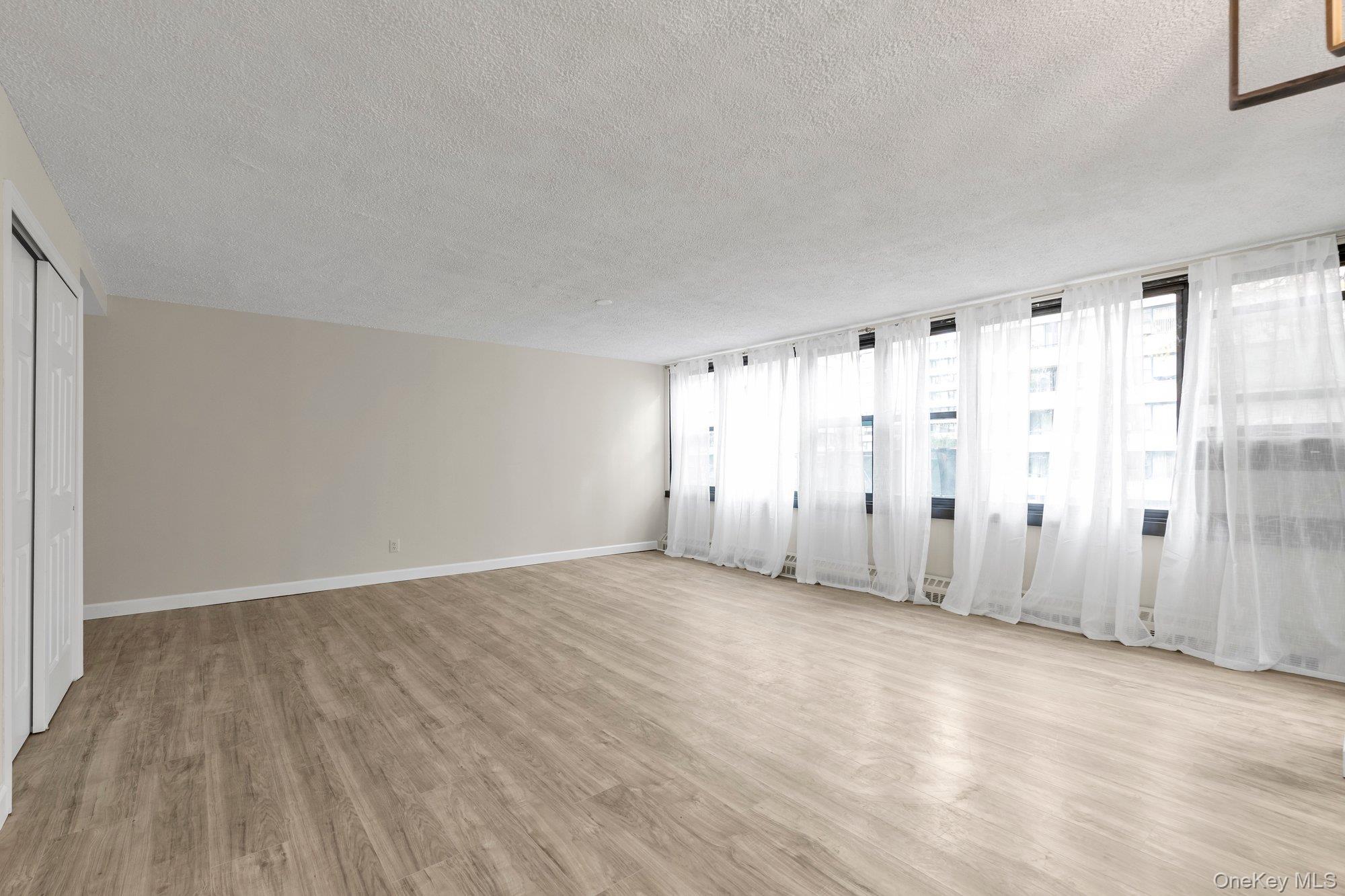 Stunning eastern exposure apartment that was just renovated to move right into.  This unit has extreme light illuminating through the entire apartment.  New custom kitchen with quartz countertops, tiled backsplash and stainless appliances.  New laminate flooring throughout that boasts new closet doors throughout apartment.  New custom bath with ample light and storage.  Elegant custom curtains that show the beauty of living in this prestigious community. Large terrace for outdoor enjoyment.  Lehavre boasts tennis, pool, gym, cafe and playgrounds to enjoy.