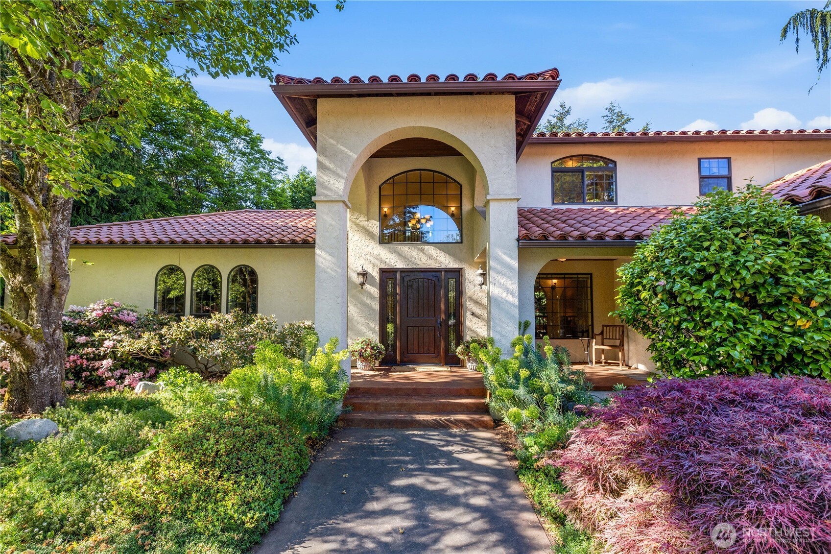 Extraordinary Ferndale estate set on 14.77 level & usable acres, just mins from I-5. This rare legacy property, tucked away on a quiet dead-end road, features a custom Spanish Mission-inspired 3BR, 2.75BA, 3,690 sqft home, completely rebuilt in 2005. Lush landscaping & an oversized wood door lead into a bright foyer w/ soaring ceilings & arched thresholds. The expansive bonus rm, perfect for gathering, features vaulted ceilings, exposed wood beams & beautiful arched windows. A cozy living room, spacious kitchen w/ abundant cabinetry & breakfast area, dining rm w/ covered patio access, laundry rm & .75BA complete the thoughtful main level. Upstairs includes a full BA, 2 BRs & a spacious primary suite w/ dreamy walk-in closet & en suite BA w/ jetted tub & walk-in shower. The magic continues outside w/ open fields, a peaceful woodland area, mature fruit trees & multiple outbuildings, creating endless opportunities for equestrian use, hobby farming, multi-gen living, ADU potential, recreation & more. There's covered parking for 12+ vehicles & extensive shop & work space across multiple outbuildings including a nearly 4,000 sqft shop w/ numerous garage bays, workshop, 17'x9' hot tub/swim spa & multi-use flex rooms providing endless options for entertaining, hobbies, fitness & more. Additional structures include a substantial barn w/ workshop & abundant space for cars, stables, tractors or storage plus a secondary barn, separate storage building & dedicated firewood structure.