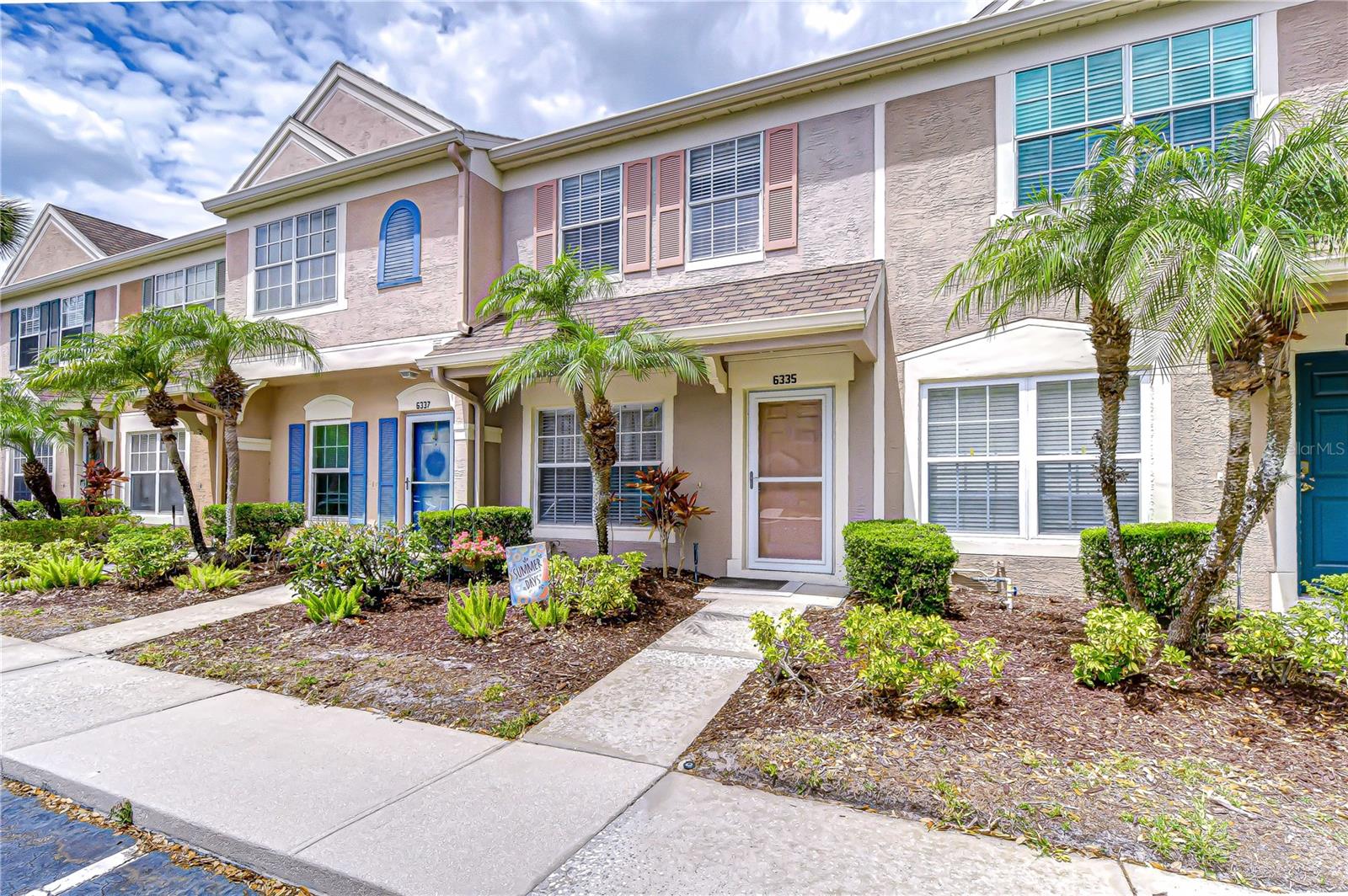 PRIME LOCATION, MOVE-IN READY, Immaculate and meticulously cared for 2 bedroom/2.5 bath 1184 square foot townhome with pond view in the gated community of the Villages of Bayport/Bayside Key. This community is adjacent to the upscale community of Bayside which affords the opportunity to bike, walk and jog in a truly beautiful and tropical environment. Easy access to Veteran's Expressway/275, Tampa International Airport, Westshore District, South Tampa, nearby public golf courses and sparkling gulf coast beaches to the west. This light and bright unit features first floor living/dining room with convenient half bath, kitchen with stainless steel appliances and utility nook with full-size washer and dryer. Sliders lead out to a cozy screened in, covered porch overlooking the pond. Extra storage room off of the porch. There are two spacious bedrooms on the second floor, both with ensuite baths and vaulted ceilings.  The primary bedroom (with pond view) has a double-wide closet to maximize storage. Enjoy the convenience of a designated parking space right in front of the unit, along with additional guest parking throughout the community. Upgrades include HVAC system 2020; water heater 2019; front storm door added 2022; both bathtubs refinished April 2026. HOA includes community pool, tennis court, car washing station, trash removal, water/sewer, master flood policy, exterior maintenance including roof/exterior paint, and lawn maintenance.