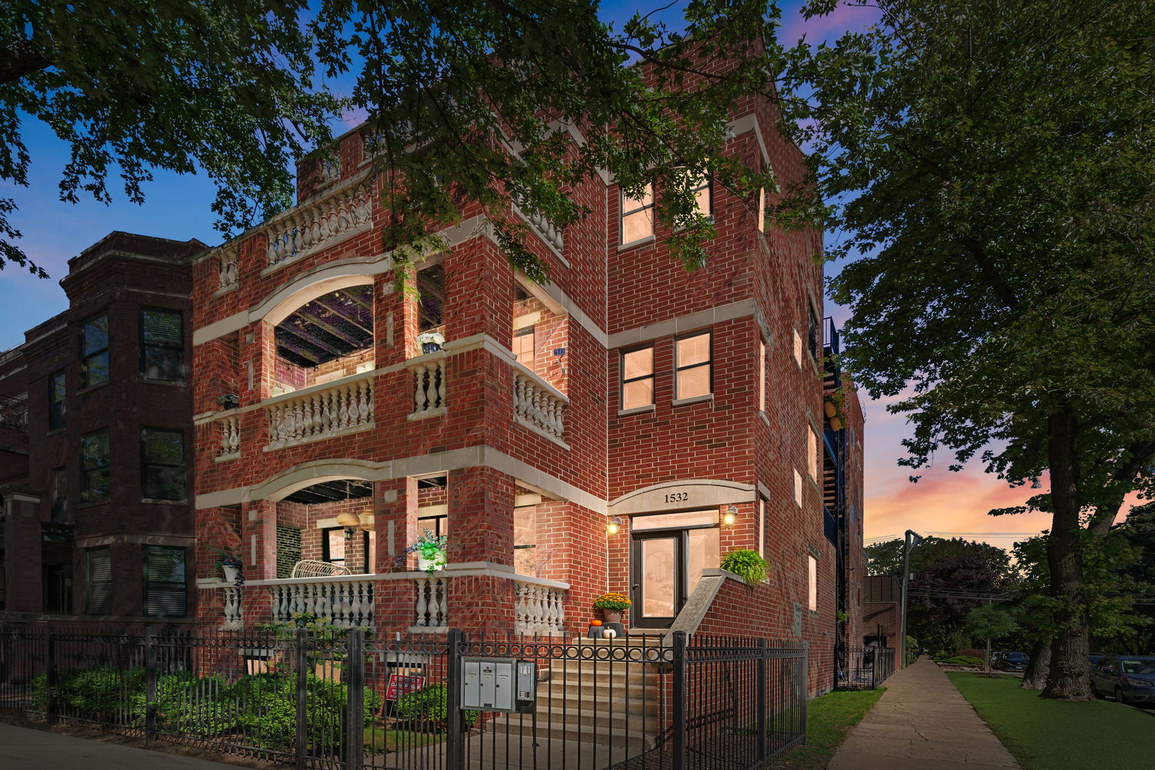 This one-of-a-kind, picture-perfect Lincoln Park condo feels straight out of a design catalog, perched on an extra-wide (35x125) corner lot overlooking the lush expanse of Wrightwood Park. With three distinct outdoor spaces-including a private roof deck offering unobstructed views of the city and neighborhood-this home is a rare gem. Inside, the three-bedroom, two-bath residence impresses with its generous proportions, 10-foot ceilings, and rich dark newly refinished hardwood floors throughout. Situated on the corner of an all-brick building, the condo is bathed in natural light thanks to its desirable South/East-facing orientation. The spacious living area features a fireplace and sliding glass doors that open to a front-facing balcony with idyllic park views. The kitchen, updated in 2024, showcases a new sleek quartz extended and large island and countertops, new appliances,freshly painted white cabinetry and brand new sink and faucet.  A coveted pantry closet adds functionality, while the adjacent dining area-with a custom built-in bench and handcrafted table-opens onto a second balcony, perfect for al fresco dining or grilling. The open space concept is exactly what someone is looking for to entertaining guests, family and friends. The private roof deck is an entertainer's dream, complete with a plumbed rooftop bar, built-in grill, sink, refrigerator, and fireplace. The oversized primary suite offers a spa-like retreat, featuring a luxurious soaking tub, separate steam shower, double vanity with high end polished granite countertops. The second bathroom with newer finishes is conveniently located down the hall from the 2nd and 3rd bedrooms which both also have custom built-in plantation window treatments. Fully custom-built bookshelf in the 2nd bedroom allows for extra storage lends itself as a potential office if needed. Throughout the home, new lighting fixtures and window treatments add a polished touch. Designed with sustainability in mind, the property includes Geo-Thermal HVAC for eco-conscious living and brand-new stackable washer and dryer. Wrightwood Park just steps from your door is ideal for recreation and relaxation. With low monthly assessments and a garage parking spot included, this condo combines luxury, location, and lifestyle in perfect harmony.