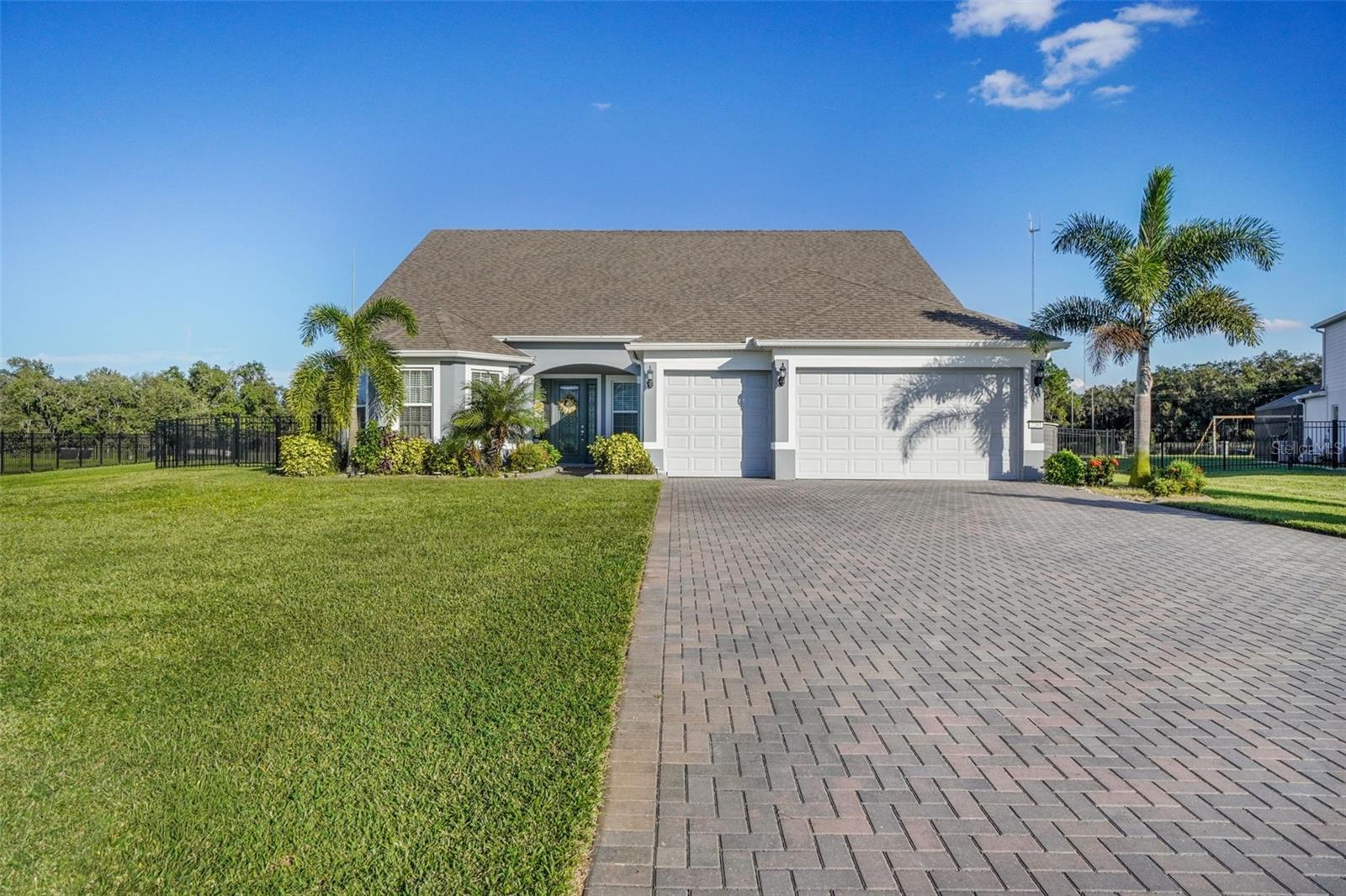 Resort-Style Living with Solar Panels Paid Off At Closing!

This like-new 4-bedroom, 4-full bath home in the exclusive Lake Pickett Sunset Preserve community truly has it all! Pull up to the oversized driveway and 3-car garage that provides parking for up to 12 vehicles—perfect for entertaining or large families.
Situated on a half-acre lot, this home features a stunning heated salt cell pool and spa, lush landscaping with fruit trees, and countless upgrades throughout. Inside, enjoy a gourmet kitchen with a custom pantry offering exceptional storage, a custom laundry room with ample hanging and folding space, and a spacious primary suite with a designer walk-in closet featuring abundant hanging and drawer space. The built-in entertainment center in the family room adds an elegant touch to this open, inviting layout.
Upstairs, you'll find a large loft ideal for game room, media area or home office, plus a generously sized bedroom and full bath.

Community amenities include a private boat ramp with lake access, open-air pavilion, and playground—perfect for Florida living at its best. Conveniently located near Top rated schools, UCF, major shopping, dining, and easy access to major highways 408 and 417, this home combines comfort, convenience, and luxury in one perfect package.

Too many upgrades to list—come see this stunning home for yourself!