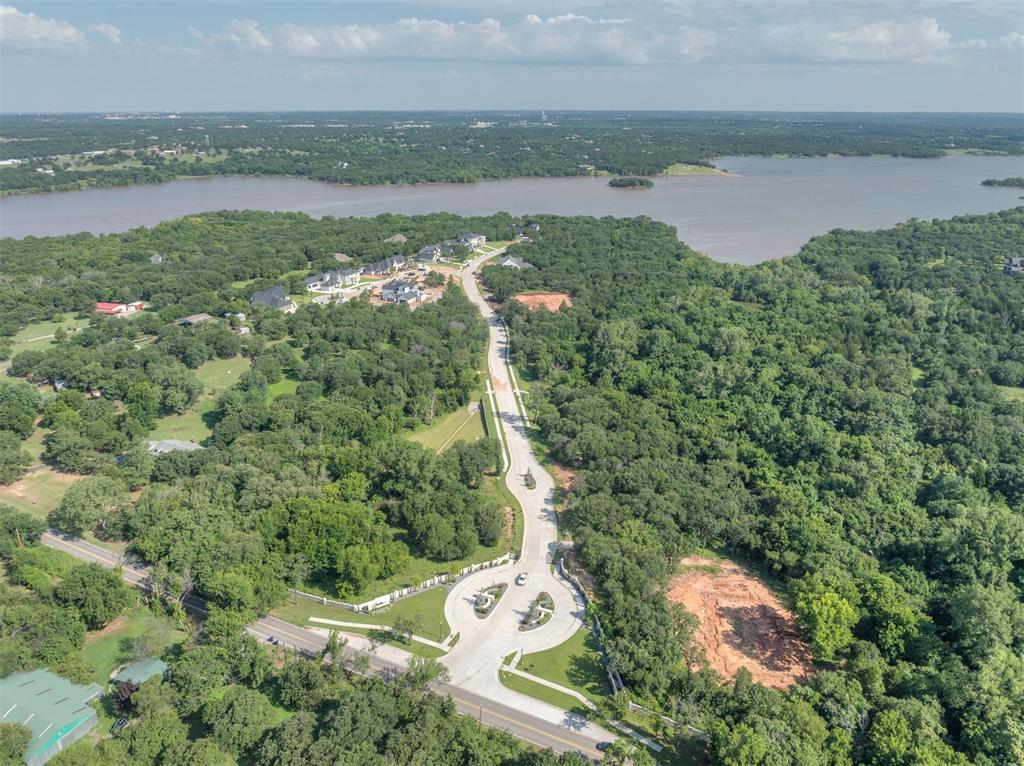 WELCOME TO SHORELINE ADDITION IN EAST EDMOND: One of Arcadia’s newest, luxury developments on the south side of Lake Arcadia within Edmond School District. This 1.17 acre lot sits within the exclusive, gated neighborhood, 21 wooded lots total in the addition. With a minimum square footage requirement of 3,500 for this specific lot, these lots are designed for spacious, high-end living, with current homes complete as well as under construction ranging from 3,500 to 9,000 square feet. This lot is wooded with mature trees and underbrush has been cleared out. While offering a serene escape, Shoreline Addition is conveniently located just 15 minutes from downtown Oklahoma City, less than 10 minutes from Arcadia Lake, and a mere 3 minutes from the I-35 on-ramp. Enjoy unparalleled privacy as this lot backs up to Army Corp of Engineers land. This ensures a tranquil and secluded environment, perfect for those seeking a peaceful retreat. Seize this opportunity to build your luxury dream home in an upscale community that seamlessly blends convenience to all the amenties along with upmost seclusion.